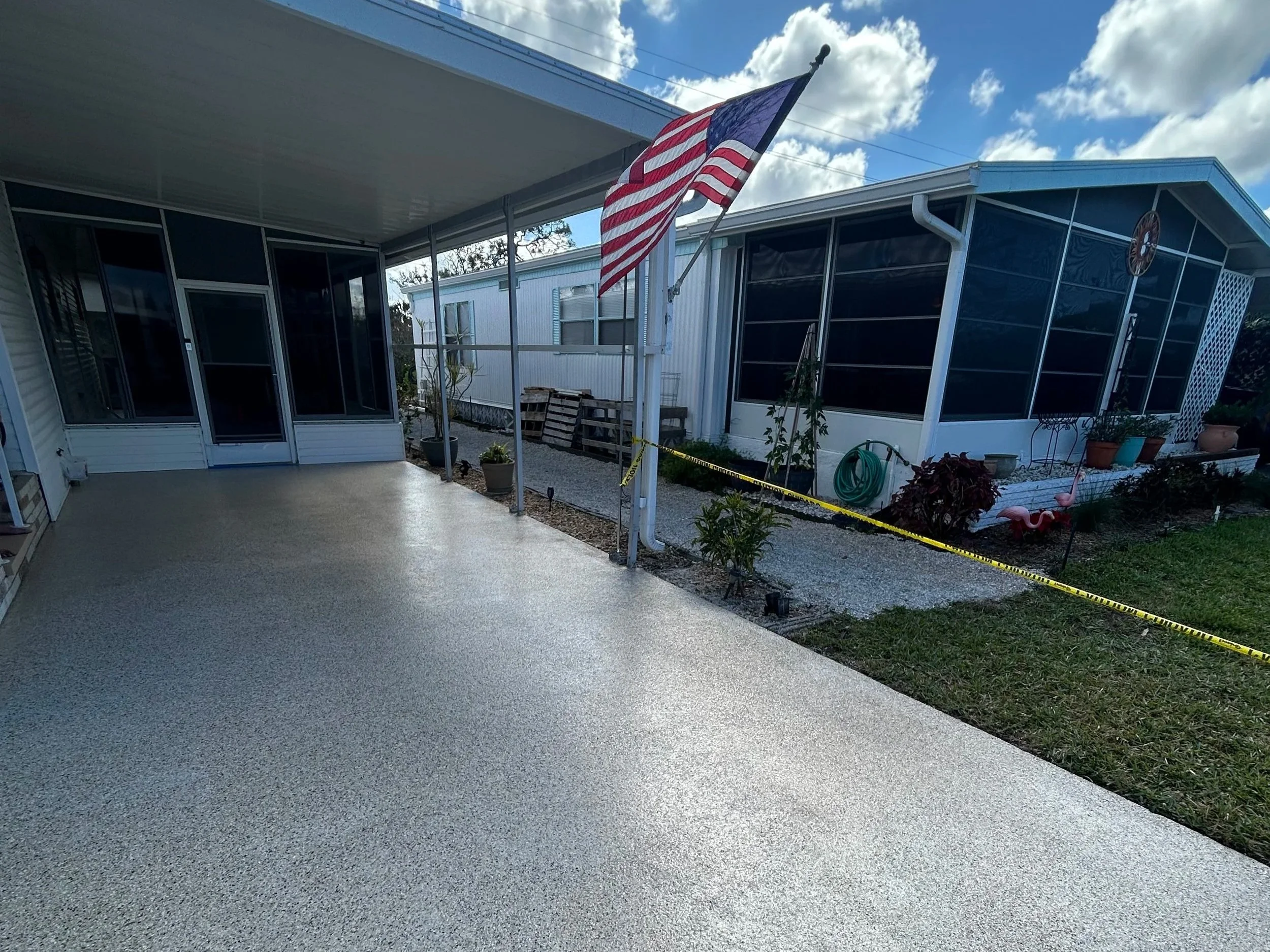 Professional epoxy coating on residential driveway in Englewood FL