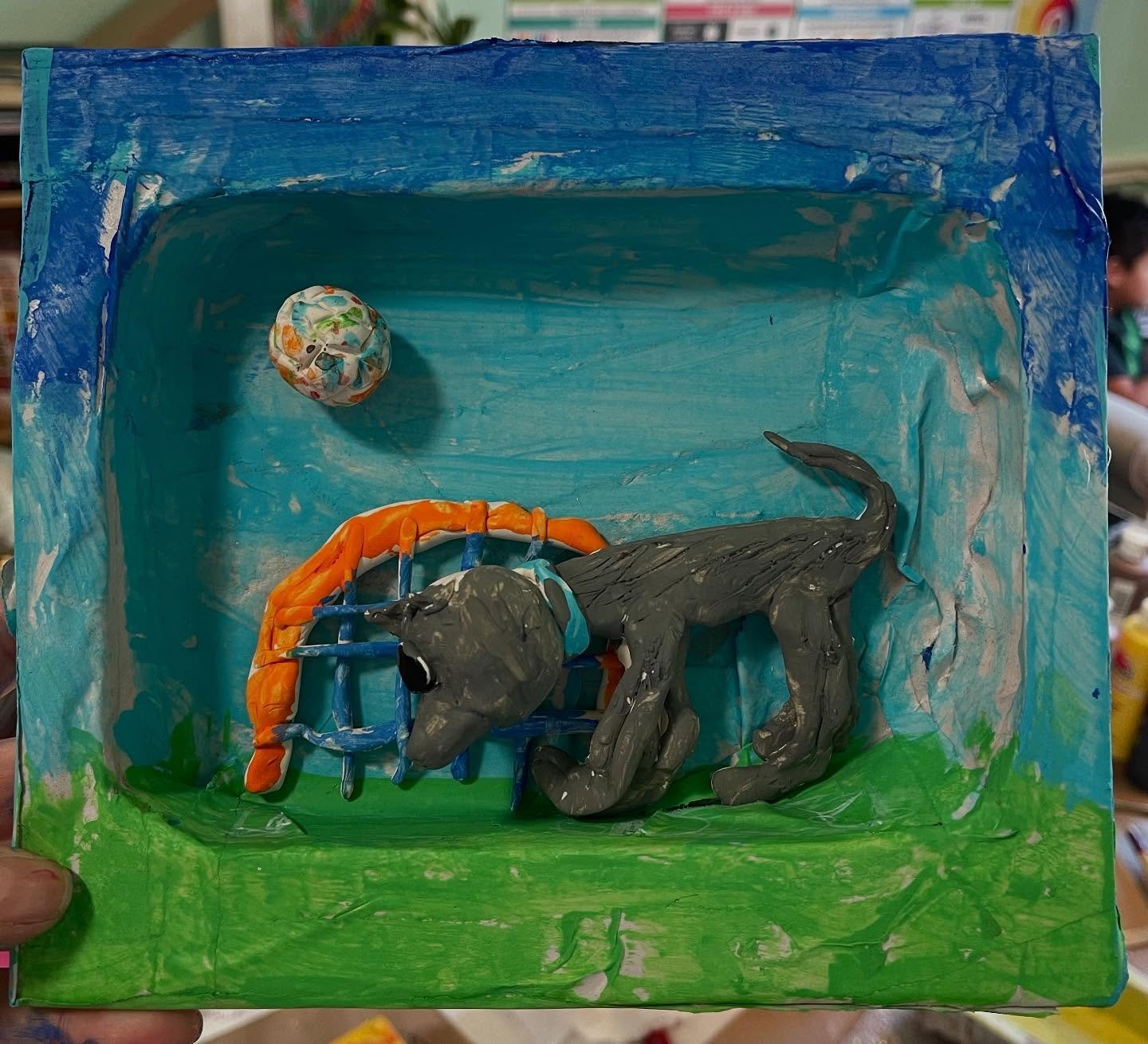 We finished up paper mache and sculpture today in homeschool art class. We recycled cardboard from a power tool box into “TV” screens and paper mached them. They sculpted their subject matter with oven bake clay. The kids were instructed