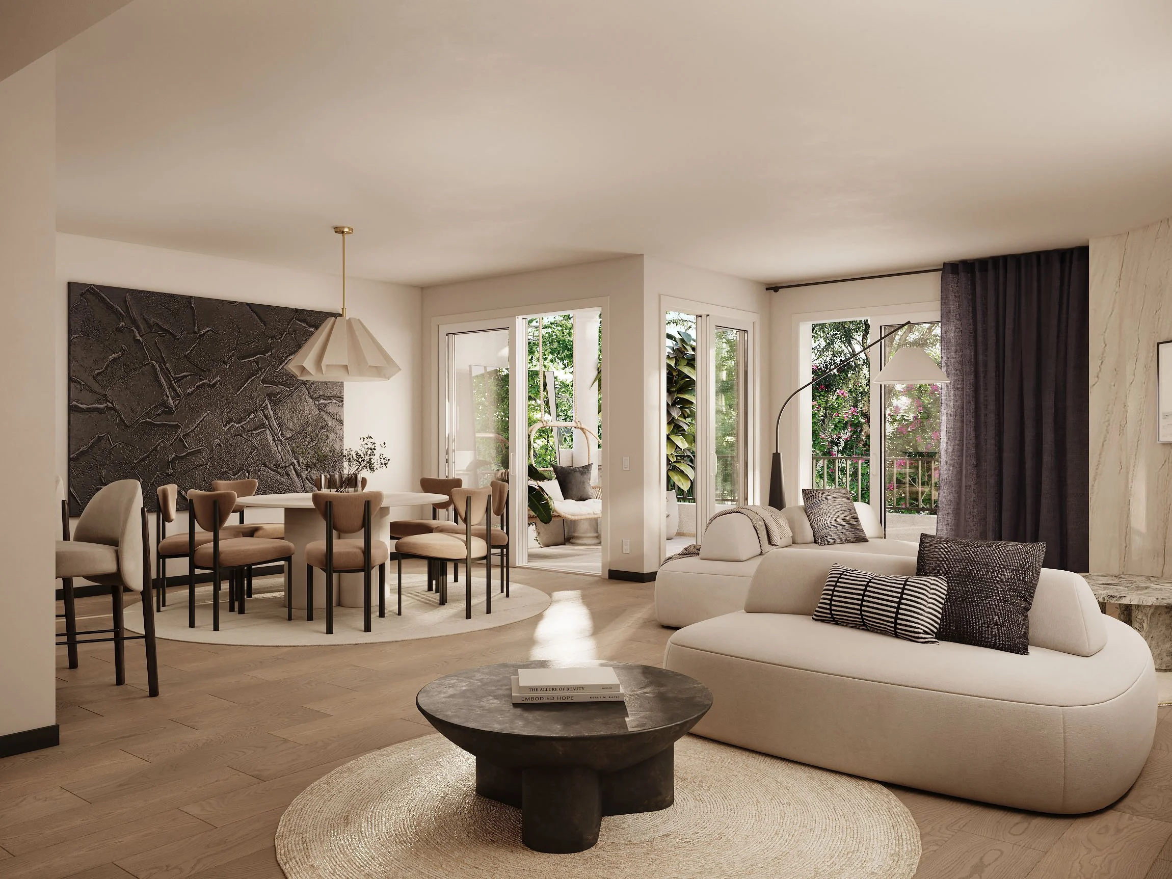 Modern open-concept living and dining area with a neutral color palette. Features a curved beige sofa with striped and textured pillows, a round black coffee table on a round woven rug, a dining table with eight beige chairs, and a large textured wal