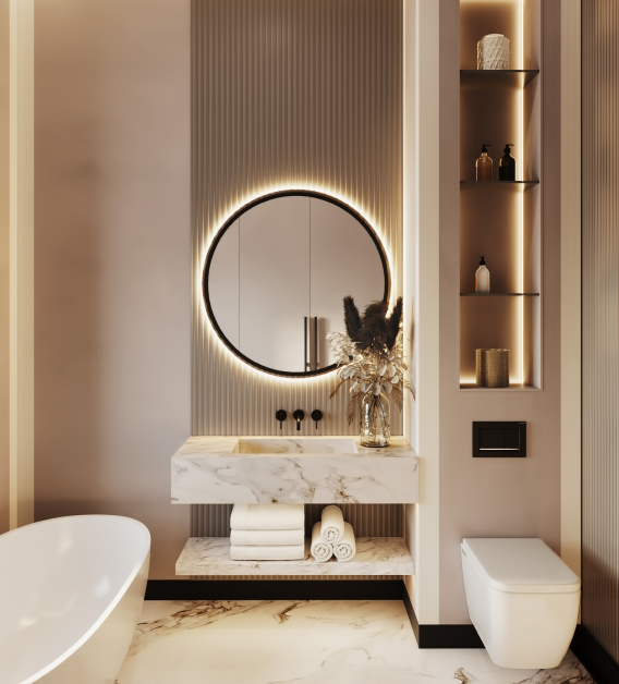 Modern bathroom with round backlit mirror, marble sink, decorative vase, rolled towels, bathtub, wall shelves with decor, and built-in toilet.