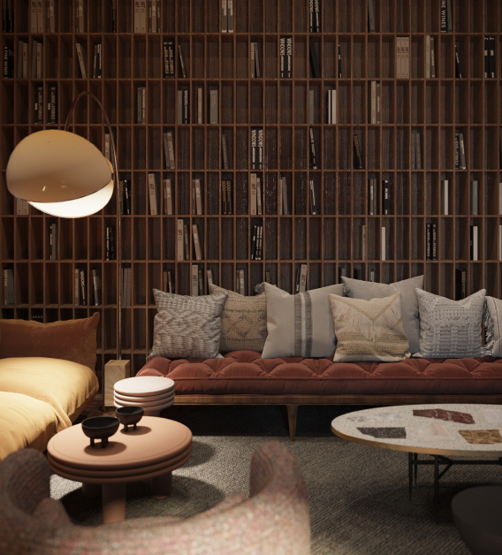 Cozy living room with brown wooden bookshelves, modern tufted sofa with mixed textured pillows, round coffee tables with decorative items, and warm lighting.