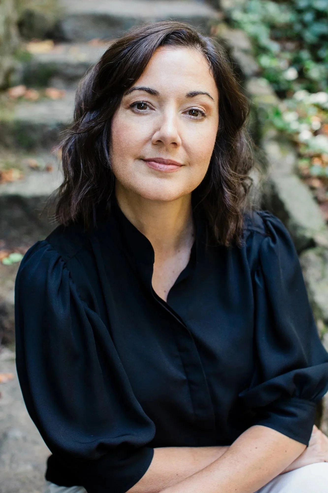 Professional headshot of Speech therapist and vocal coach Kristen Calhoun in natural light.