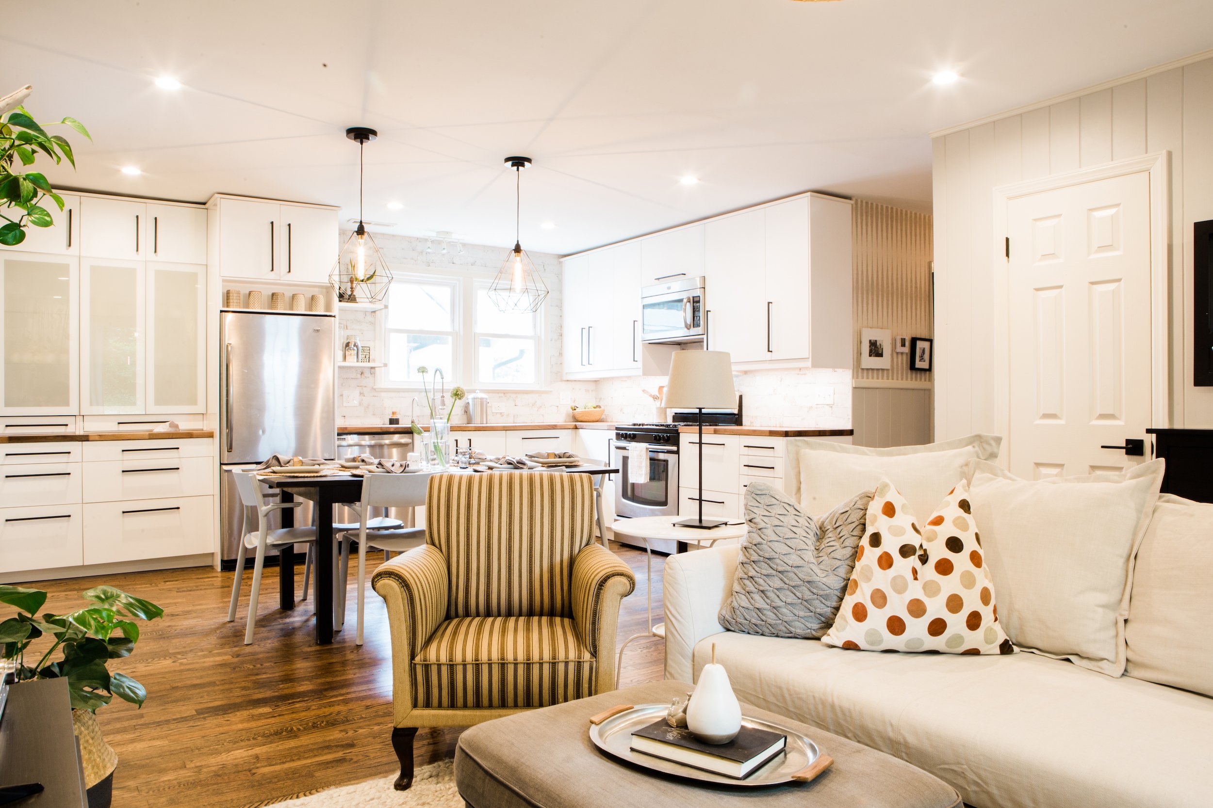Scandinavian kitchen and open living room with vintage decor and white aesthetic.
