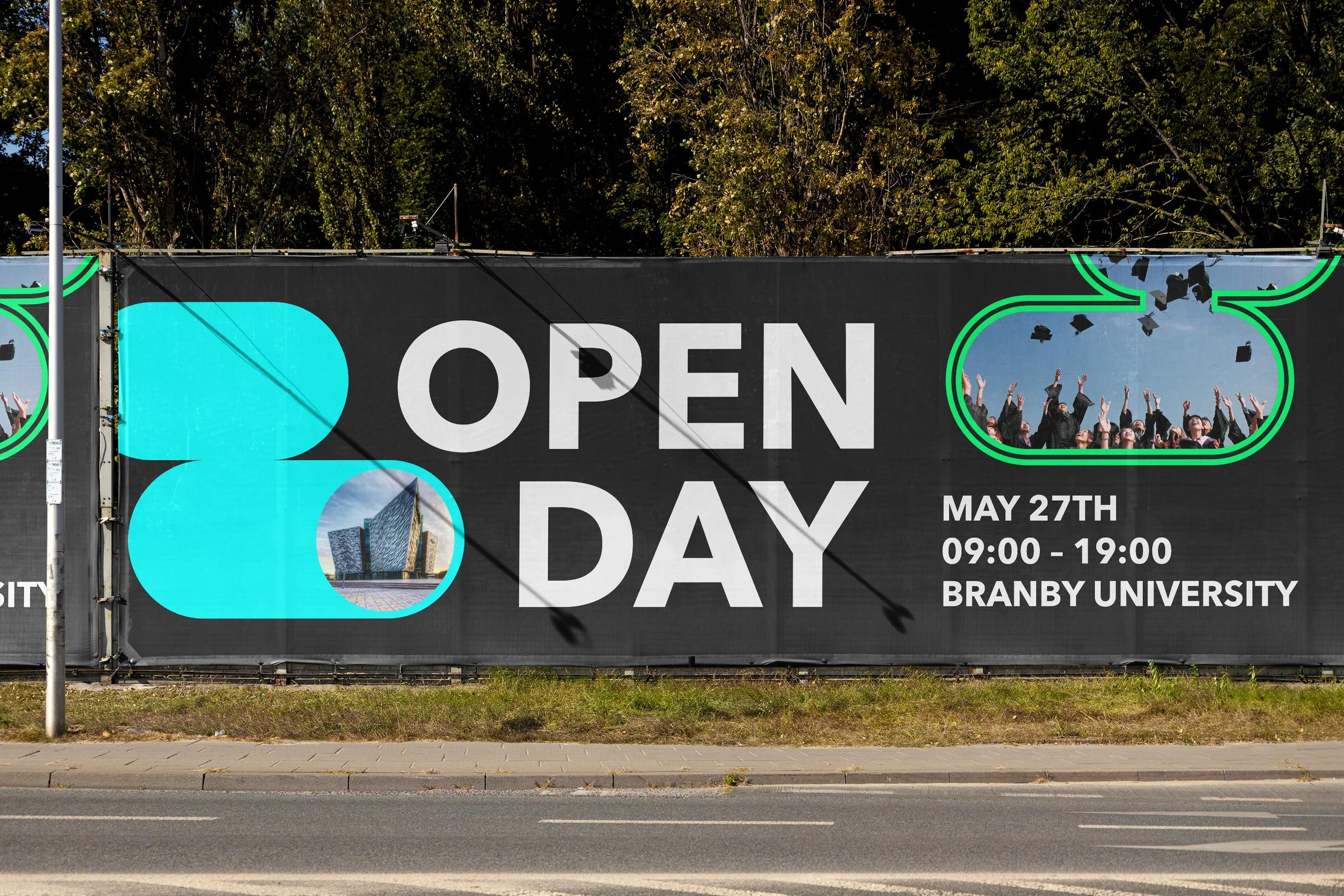 A mesh banner hanging on a fence in-front of some trees, the banner is black and reads "Open day" in large text. Contains images of a college and students throwing their graduation caps in the air.