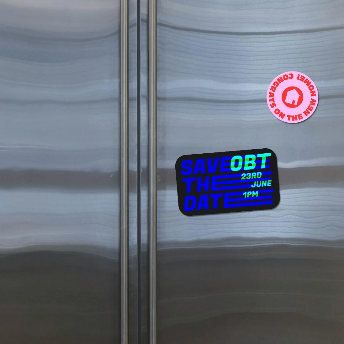 Two fridge magnets stuck to a shiny silver fridge door, one is black and dark blue with the words "Save the Date" and the other is a red and pink small magnet reading "Congrats on the new house" and has an icon of a house in the centre.
