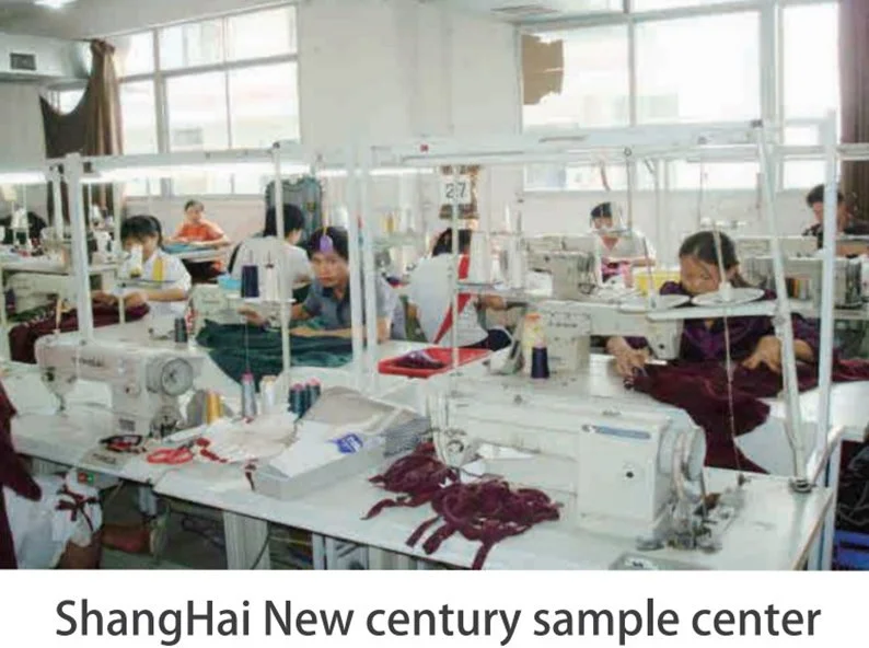 Women working at sewing machines in a factory with natural light coming through large windows.