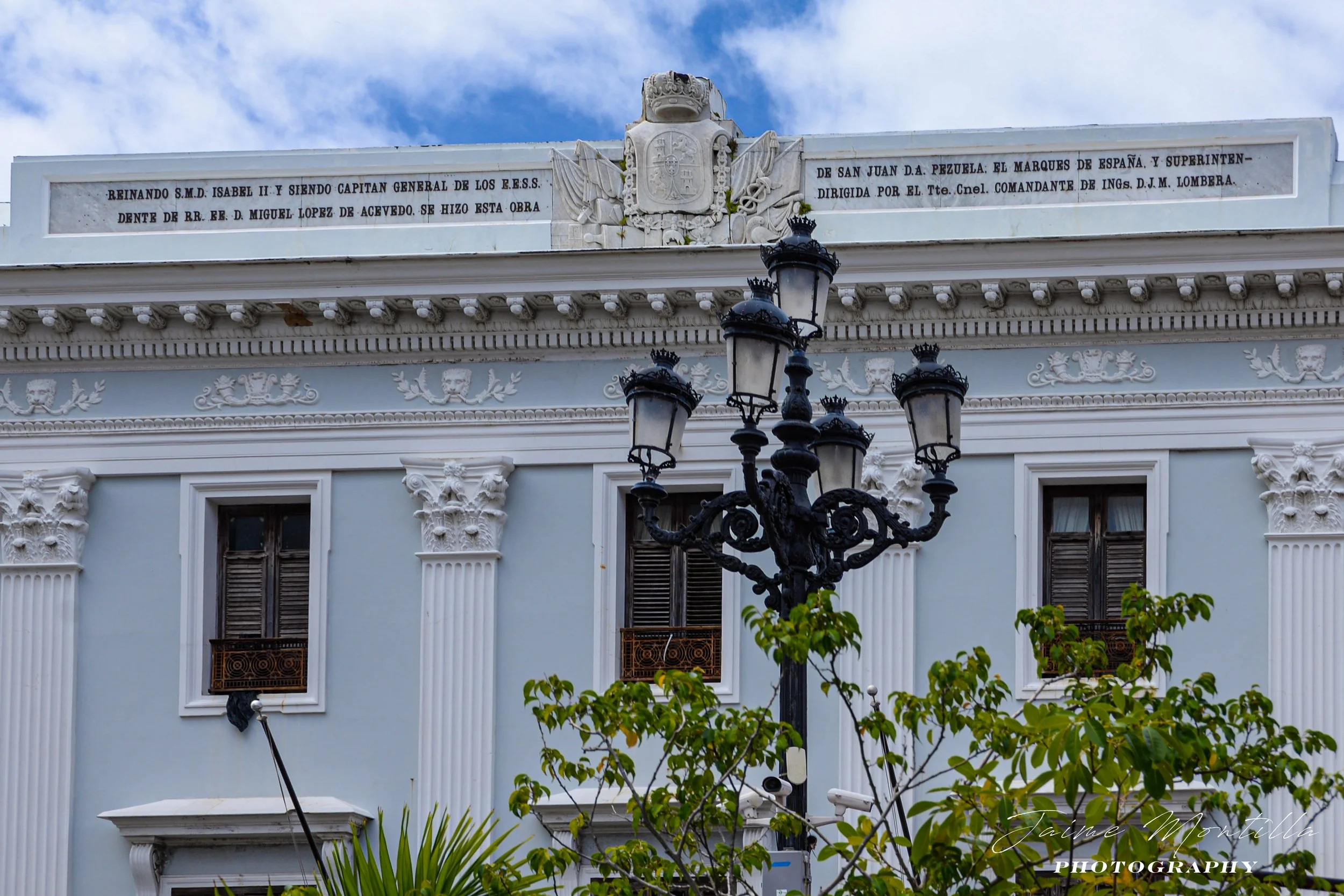 Real Intendencia or Royal Treasury was built between 1850 and 1852 at the west end of Plaza de Armas, its design is attributed to Royal Corps of Engineers' Juan Manuel Lombera who also designed the Ballajá Barracks.