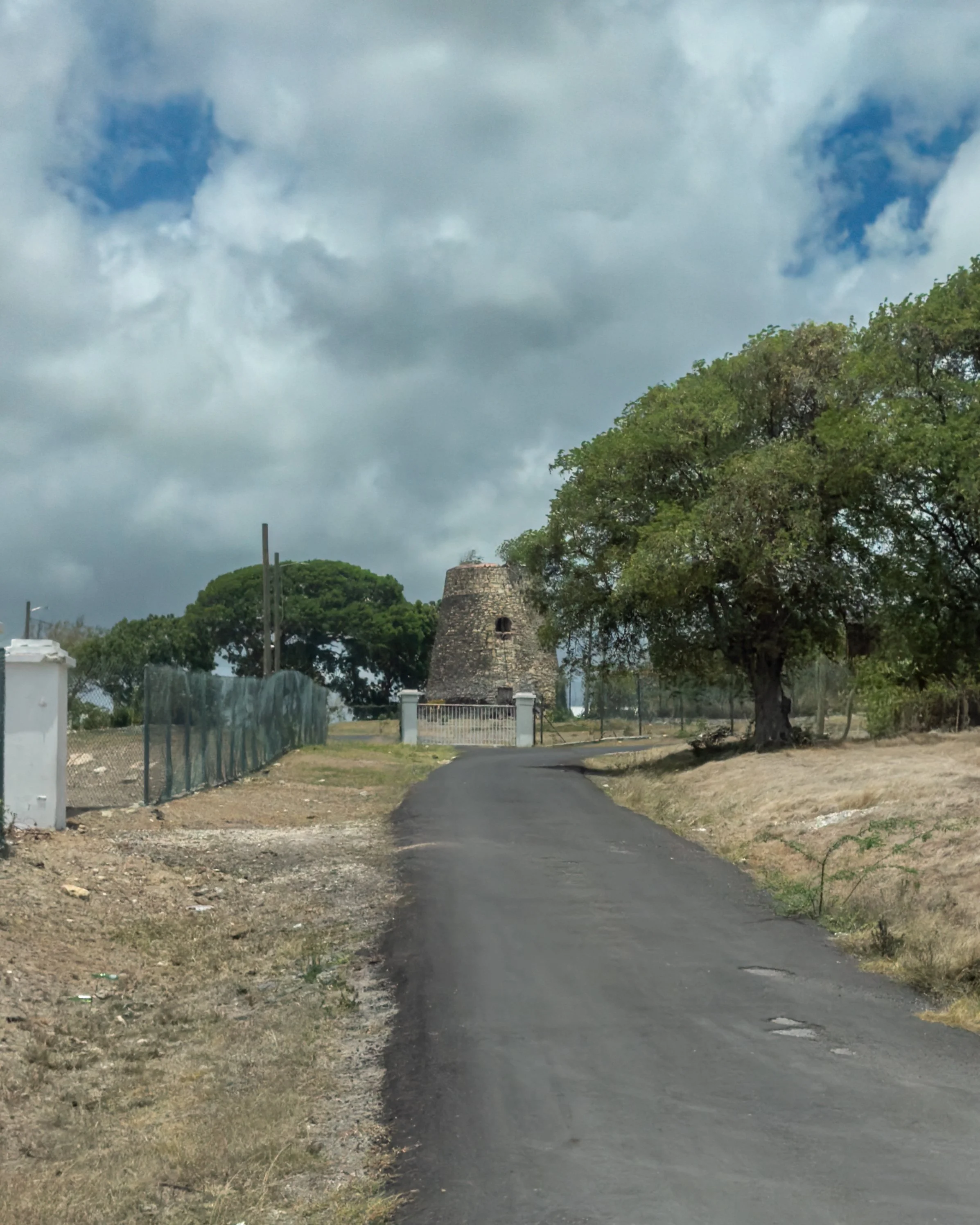 Windmill at the Tomlinson Estate, a large scale sugar cane plantation that converted to steam in the mid-1800s and later integrated into the agricultural operations of the Antigua Syndicate Estates, Ltd no on the grounds of The Harrison Centre  of th