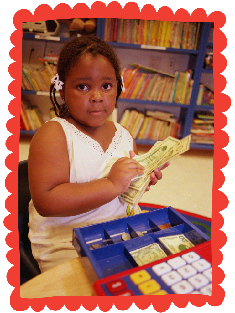 Girl counting toy money.