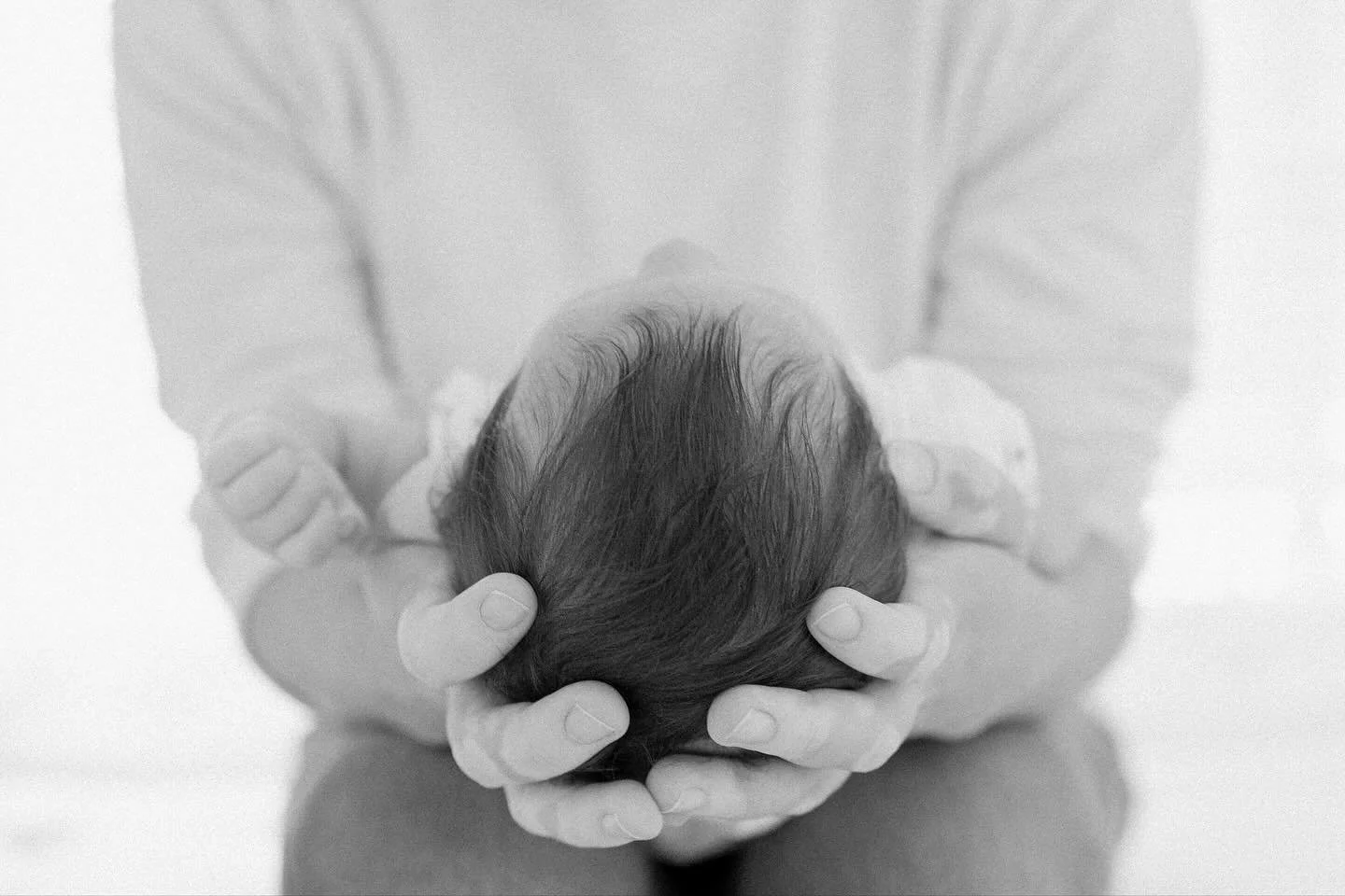 Mama holding her baby girl, tiny head in her hands, and all the love in one frame.
⠀
Nothing fancy, nothing posed&mdash;just the
purest little moment to remember. 🤍