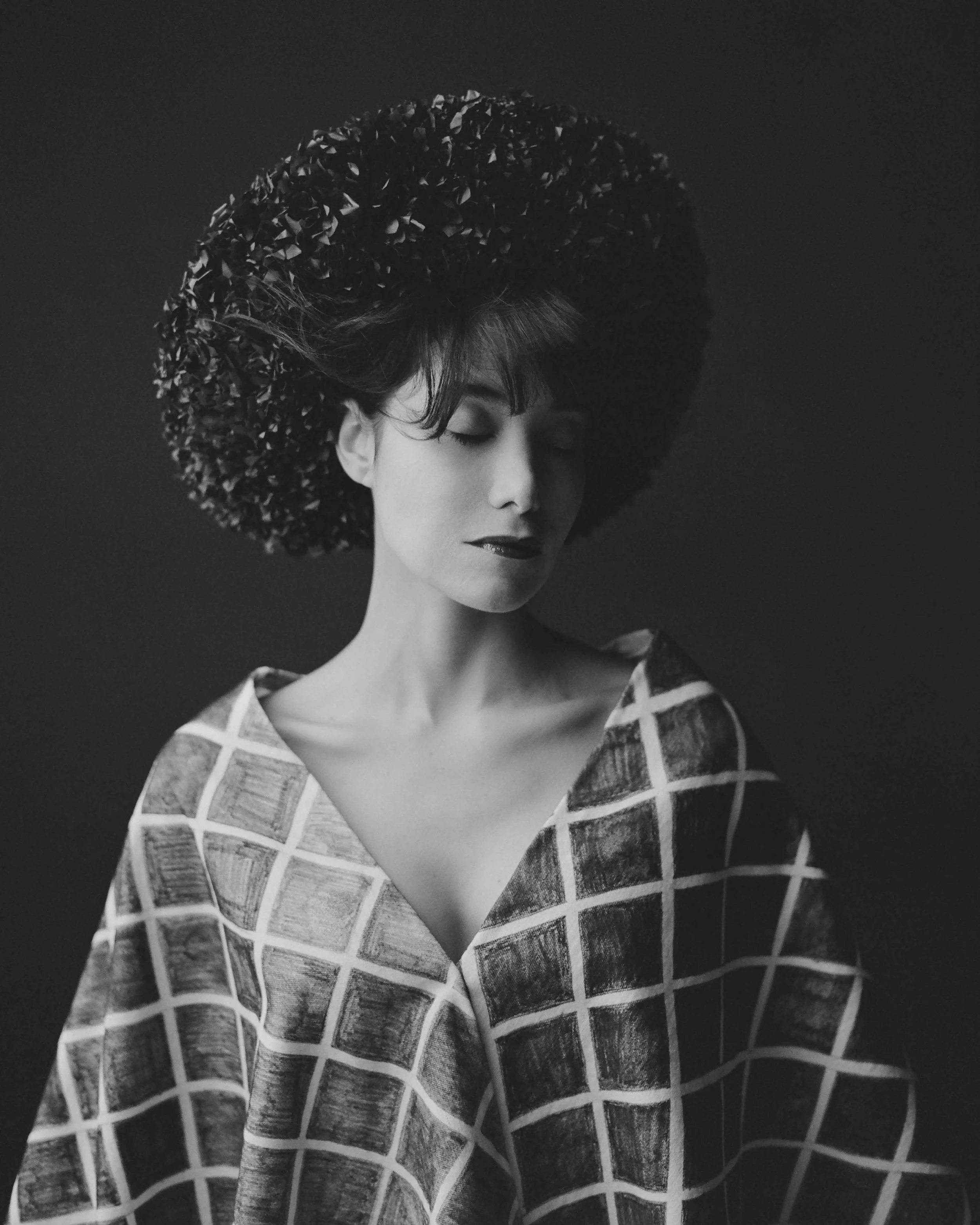 A quiet portrait where light, texture, and form come together to create a sense of stillness and introspection.