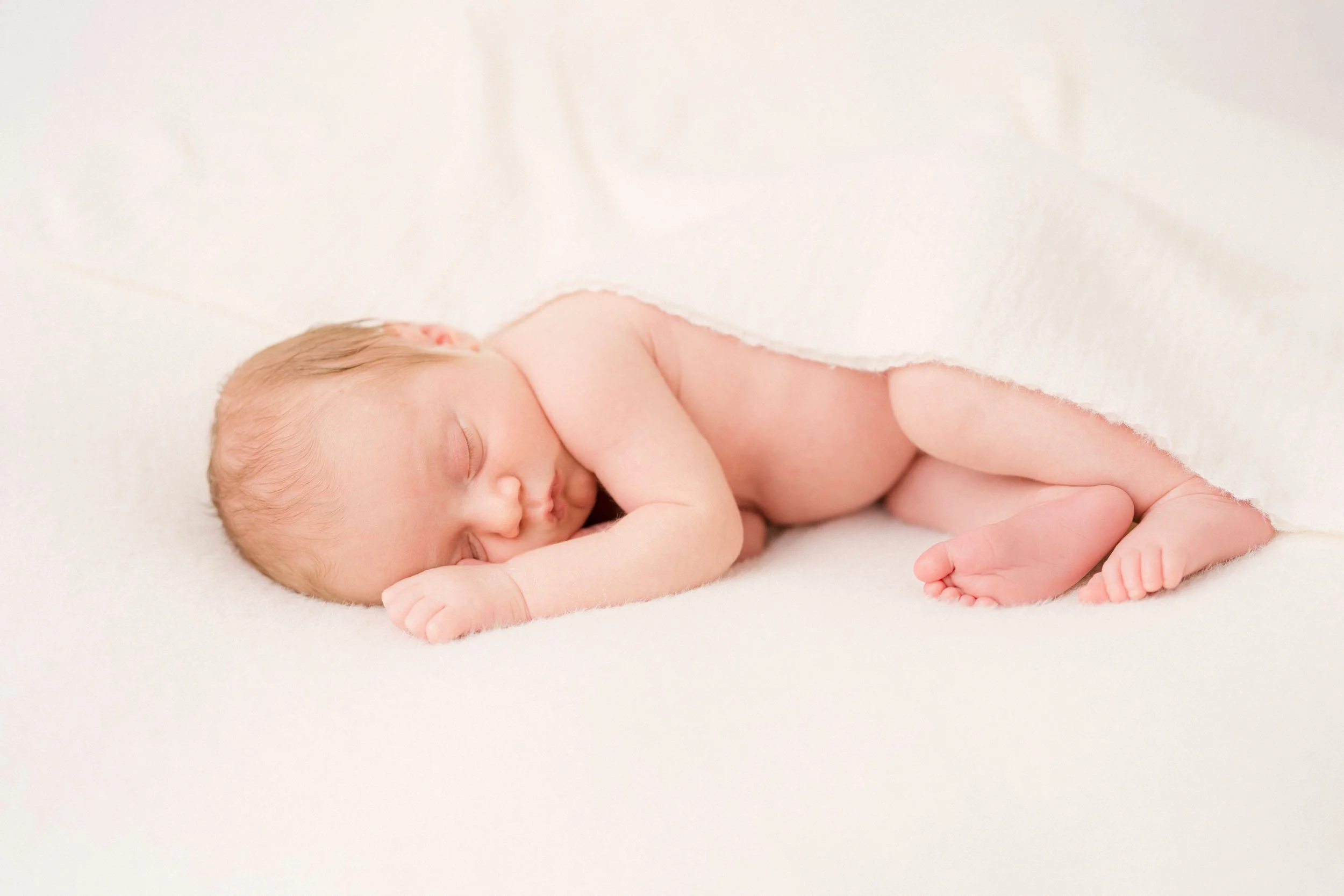 Newborn baby sleeping peacefully during a studio session in Charlotte, NC
