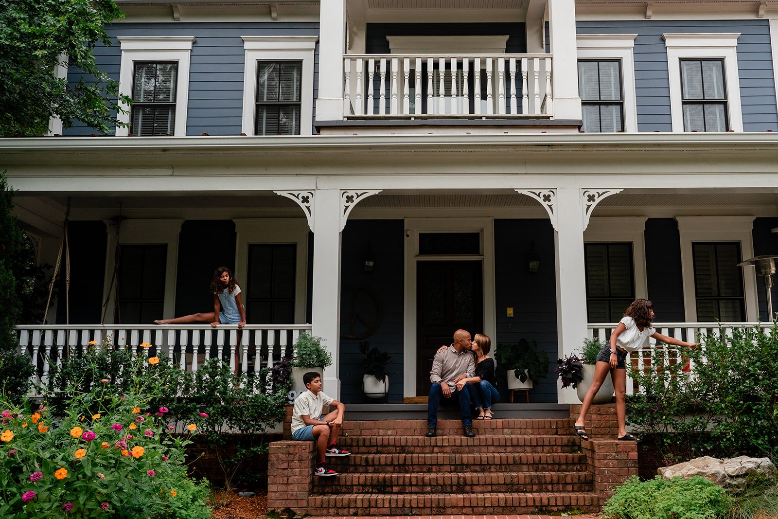 Family sitting on their front steps