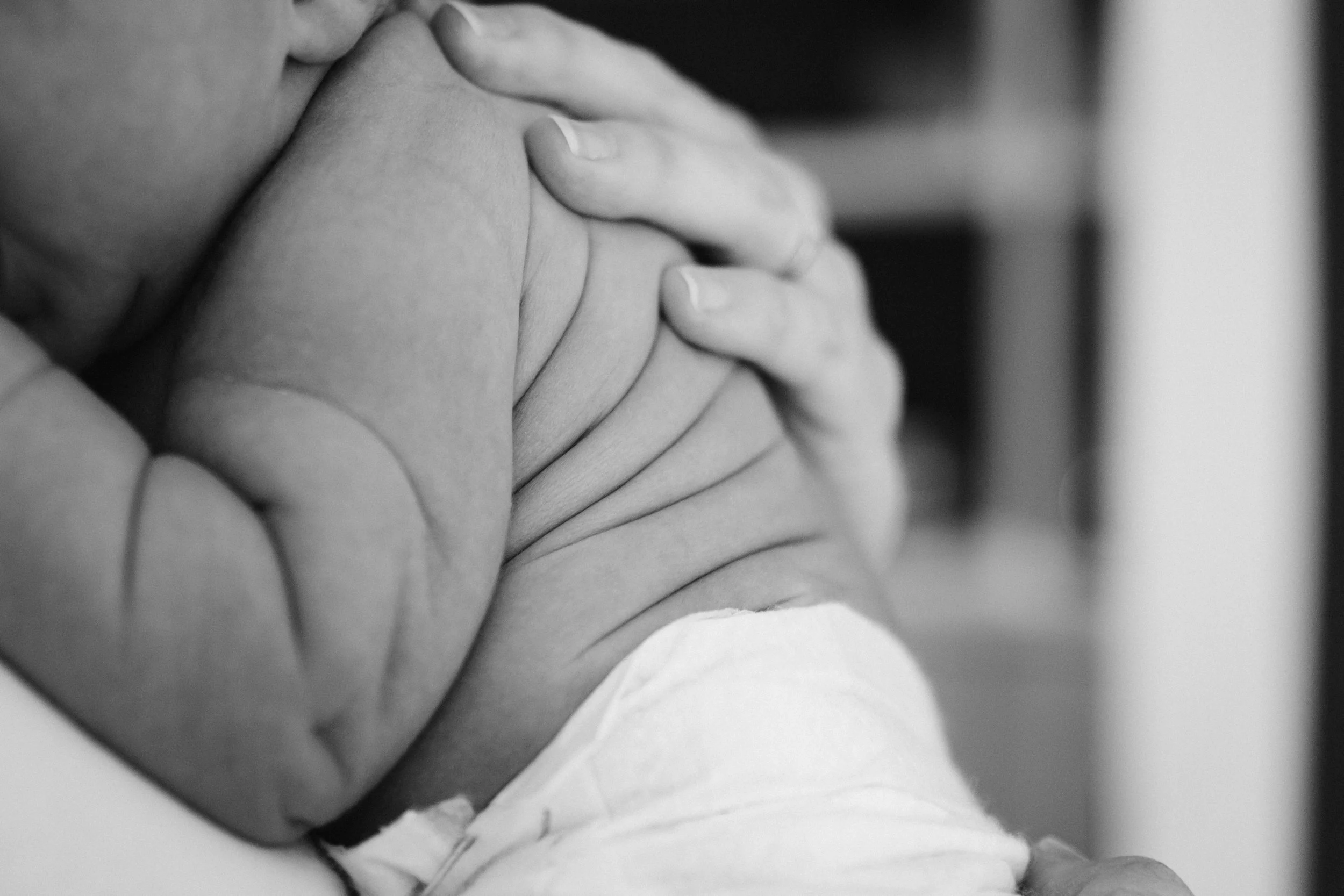 Baby's back in mom's hands