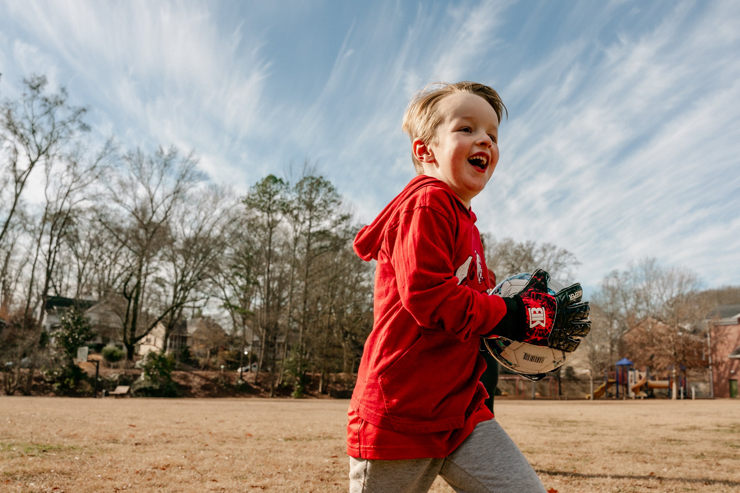 Boy running with a soccer ball