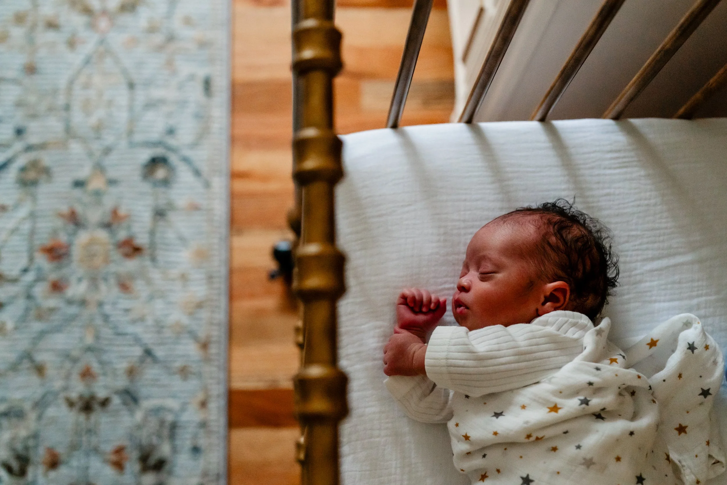 Newborn baby asleep in her crib at home in Atlanta