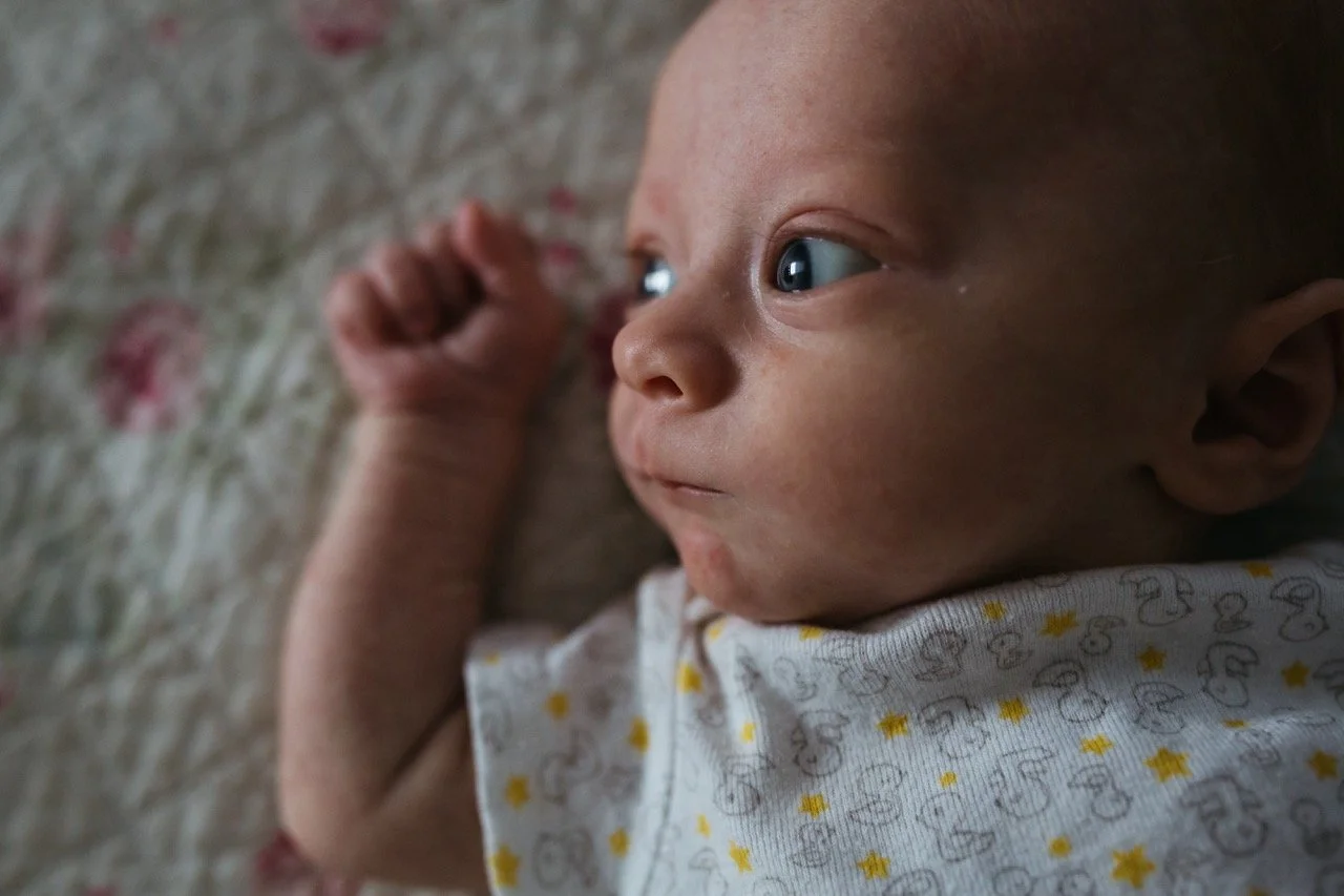 Newborn baby on the bed at home in Decatur