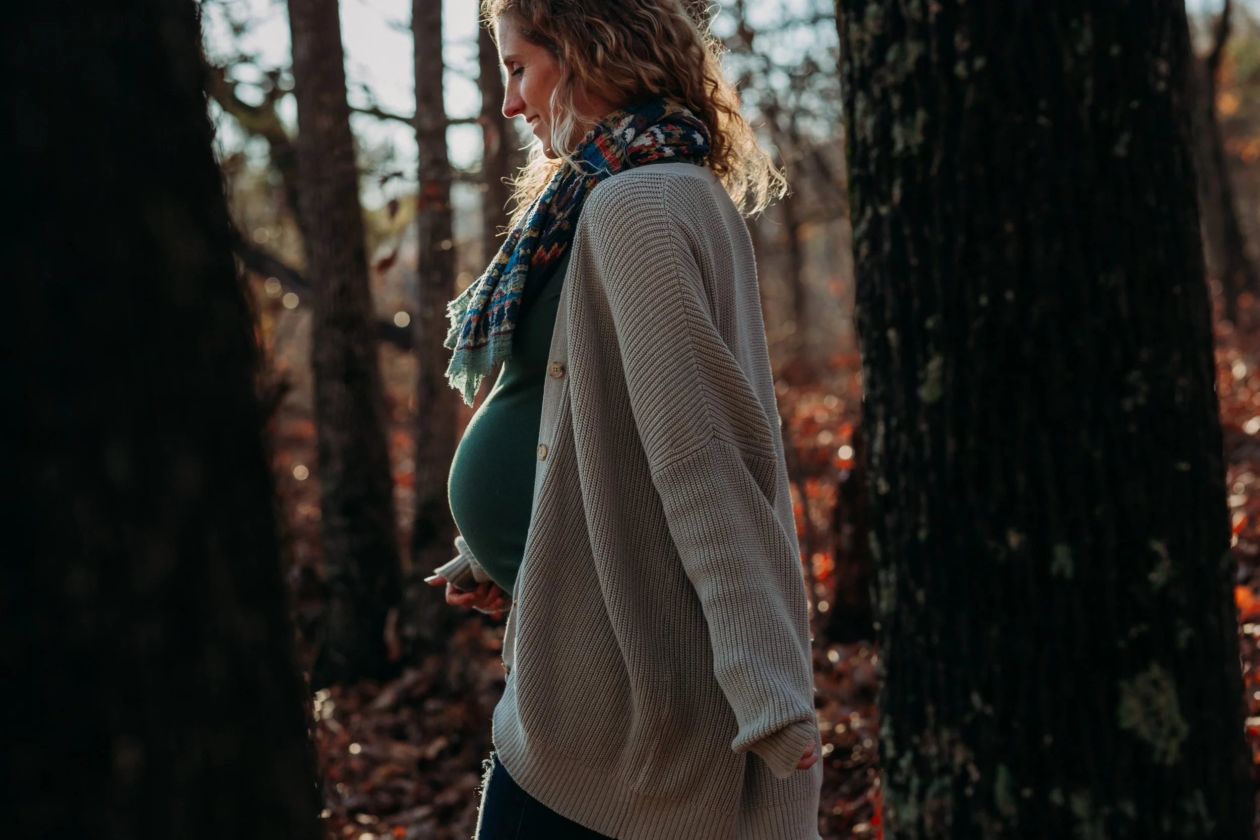 Pregnant Mother walking through the woods