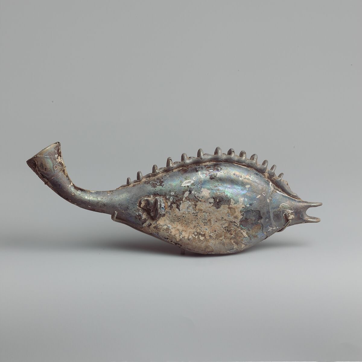 Glass flask in the form of a fish.
Roman, 3rd century CE.