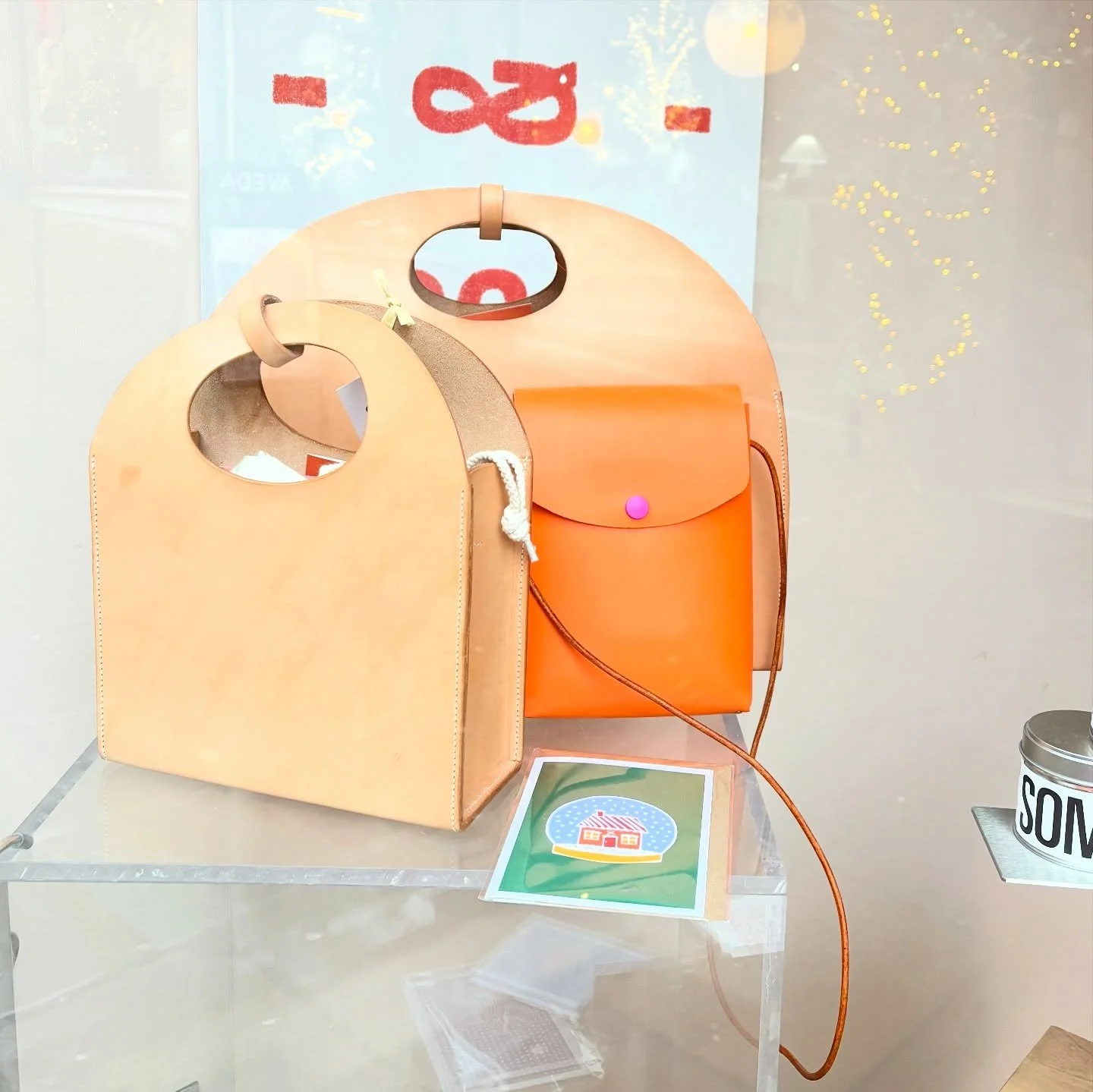 Spotted the Mini and Midi Curve bags in natural and the Sherald crossbody in zingy orange veg tan leather in the window of @store_somer yesterday alongside other brilliant local brands @seeandquin @sundae.press @pressedandfolded @kittyflorastudio @ap