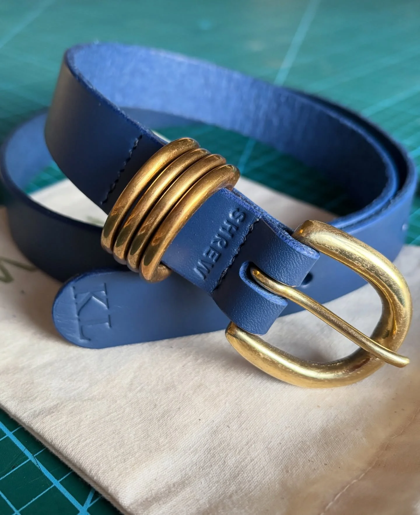 B O W  B E L T 

A custom belt, hand cut and stitched in thick, royal blue Italian vegetable leather, paired with chunky solid brass buckle and keepers. Personalised initials on the tip make the belt unique to its owner.

This belt was commissioned b
