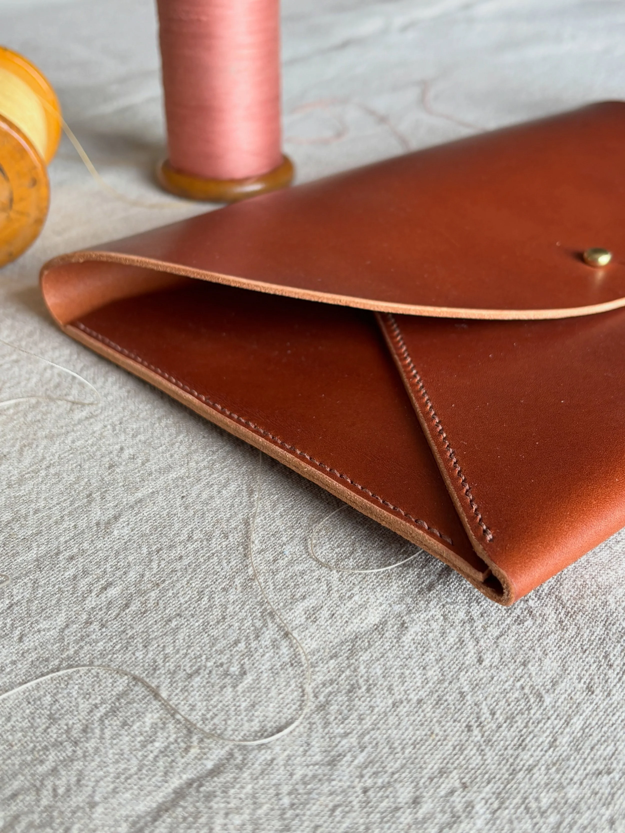 A beautiful leather pouch designed for travel and everyday organisation.

Perfect for carrying travel documents, a Kindle, makeup, notebooks, or those small things that deserve a special place to live!

Handcrafted from thick vegetable tanned leather