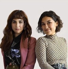 Also Known As
Kara McGuire &
Ashlee Arceneaux Jones Two women standing side by side, smiling, against a plain white background.