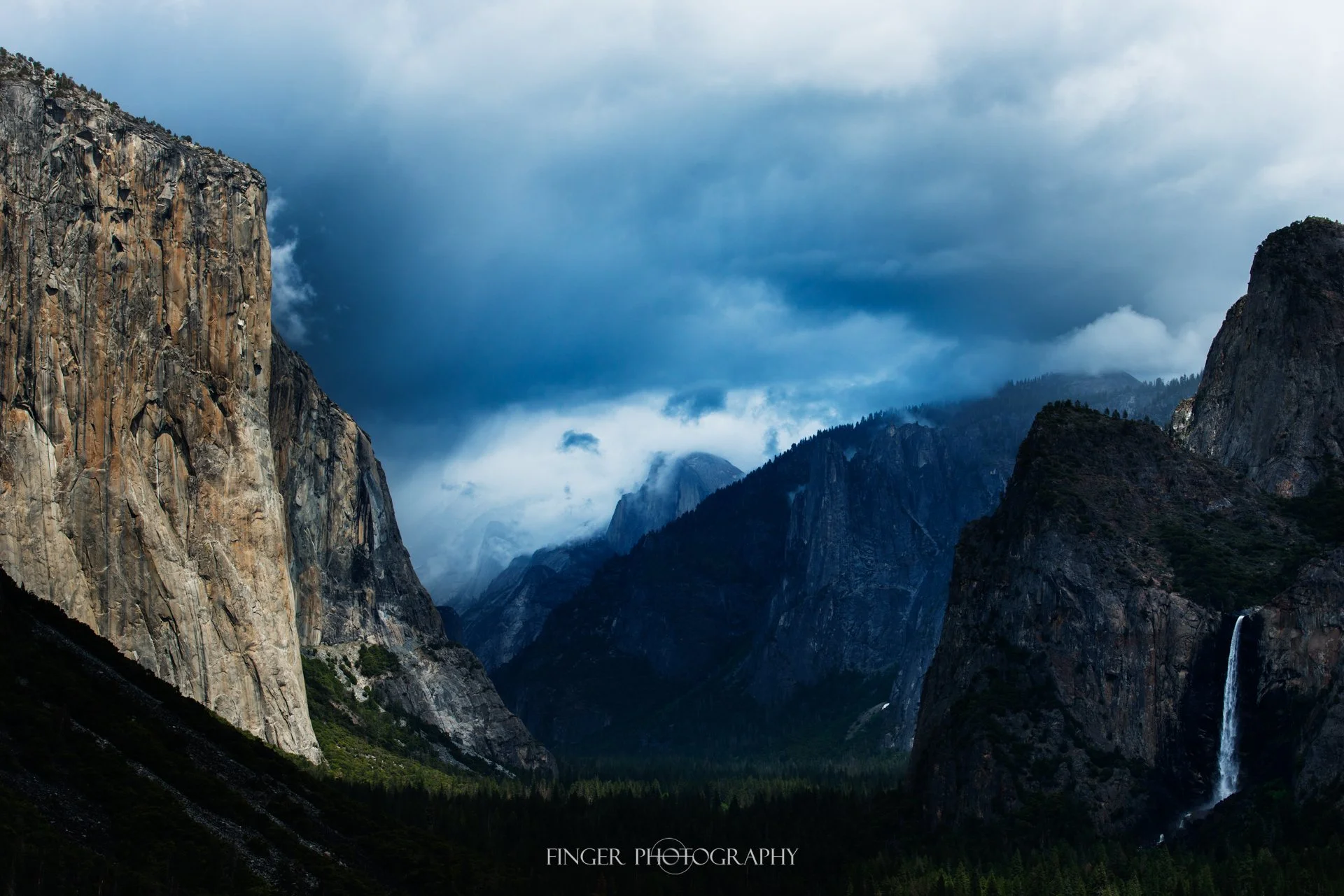 Half Dome, El Capitan and Bridalveil Falls from Inspiration Point in Yosemite, California.