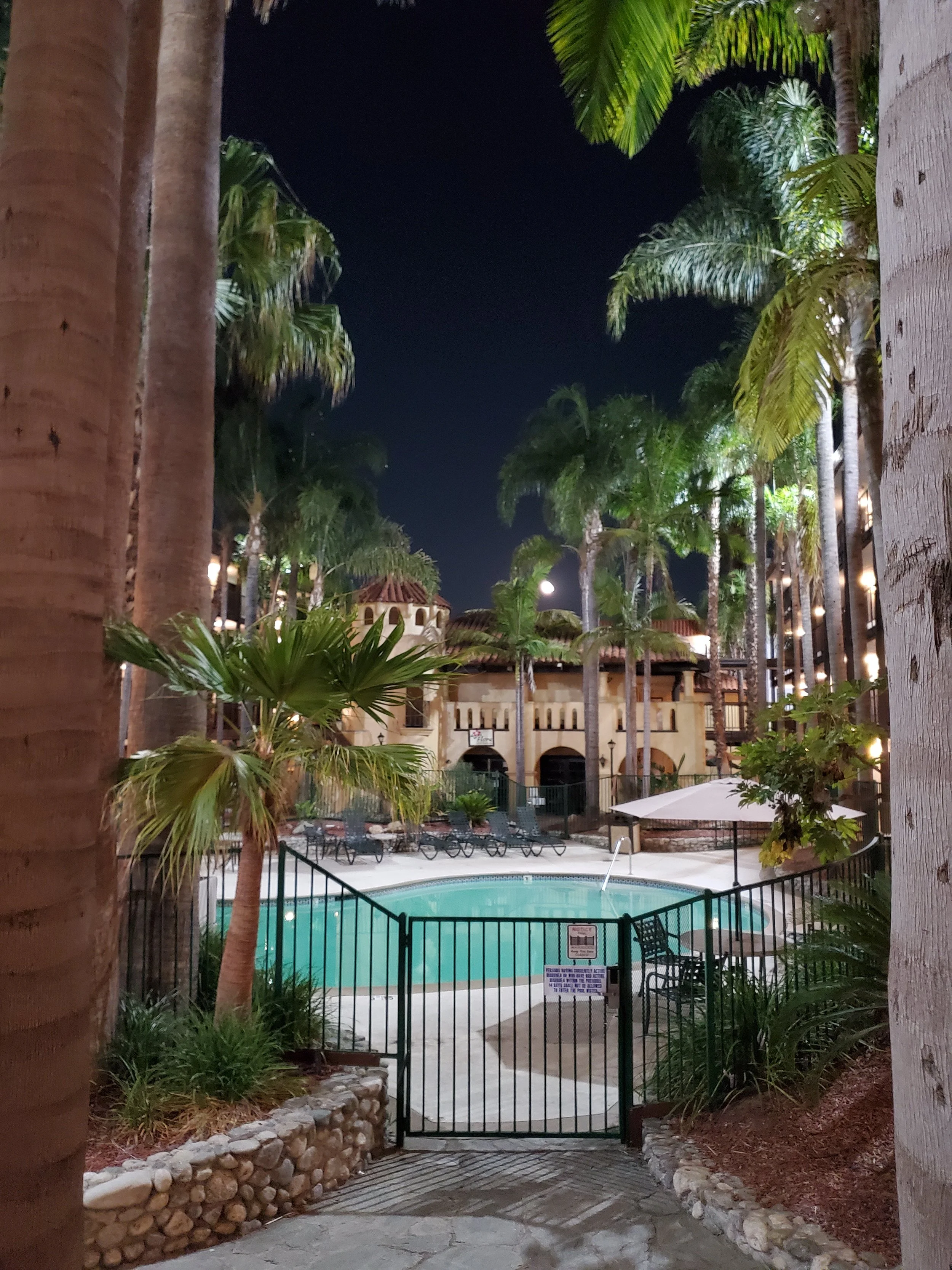The pool at a hotel courtyard at night