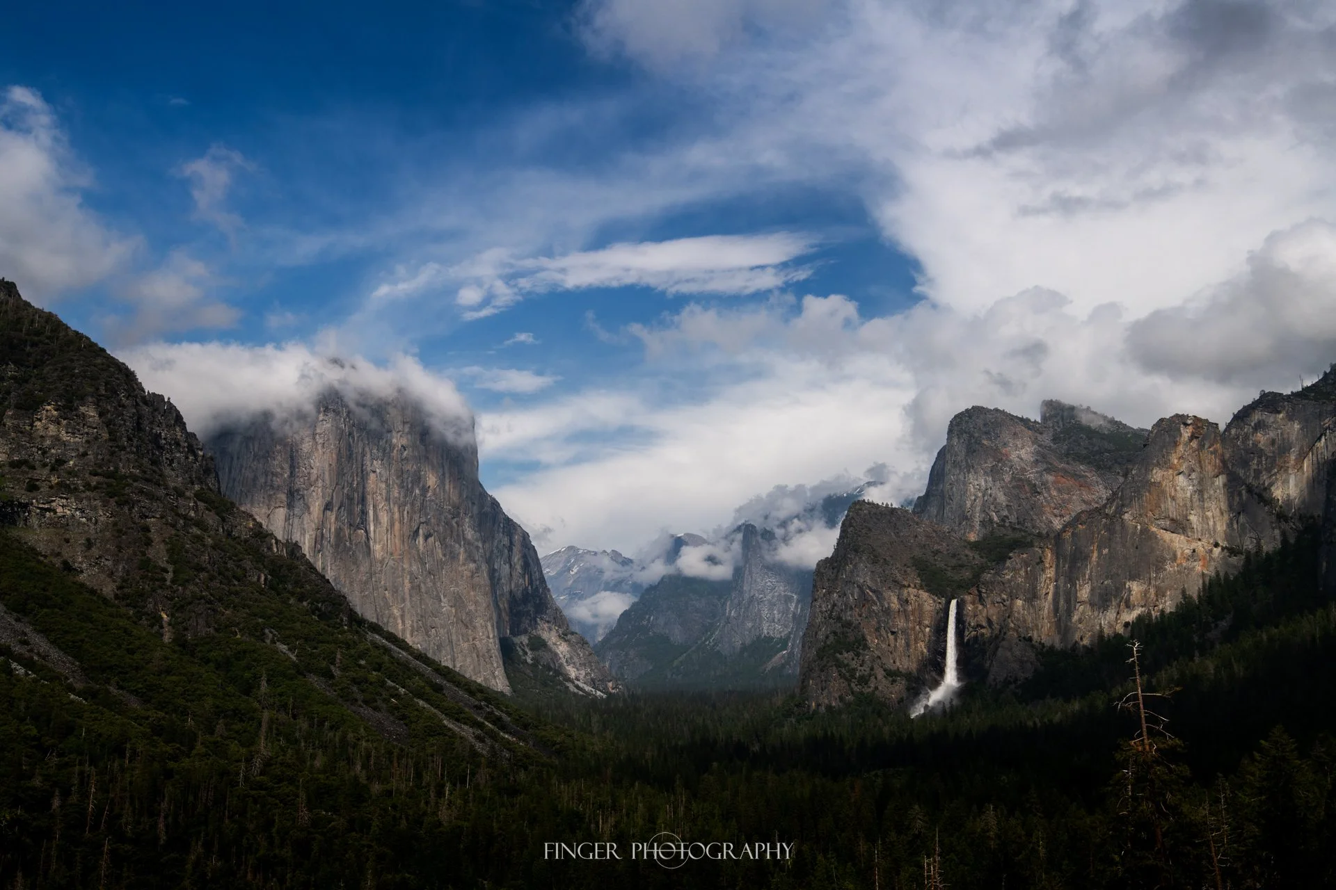 Inspiration Point in Yosemite with dramatic clouds.