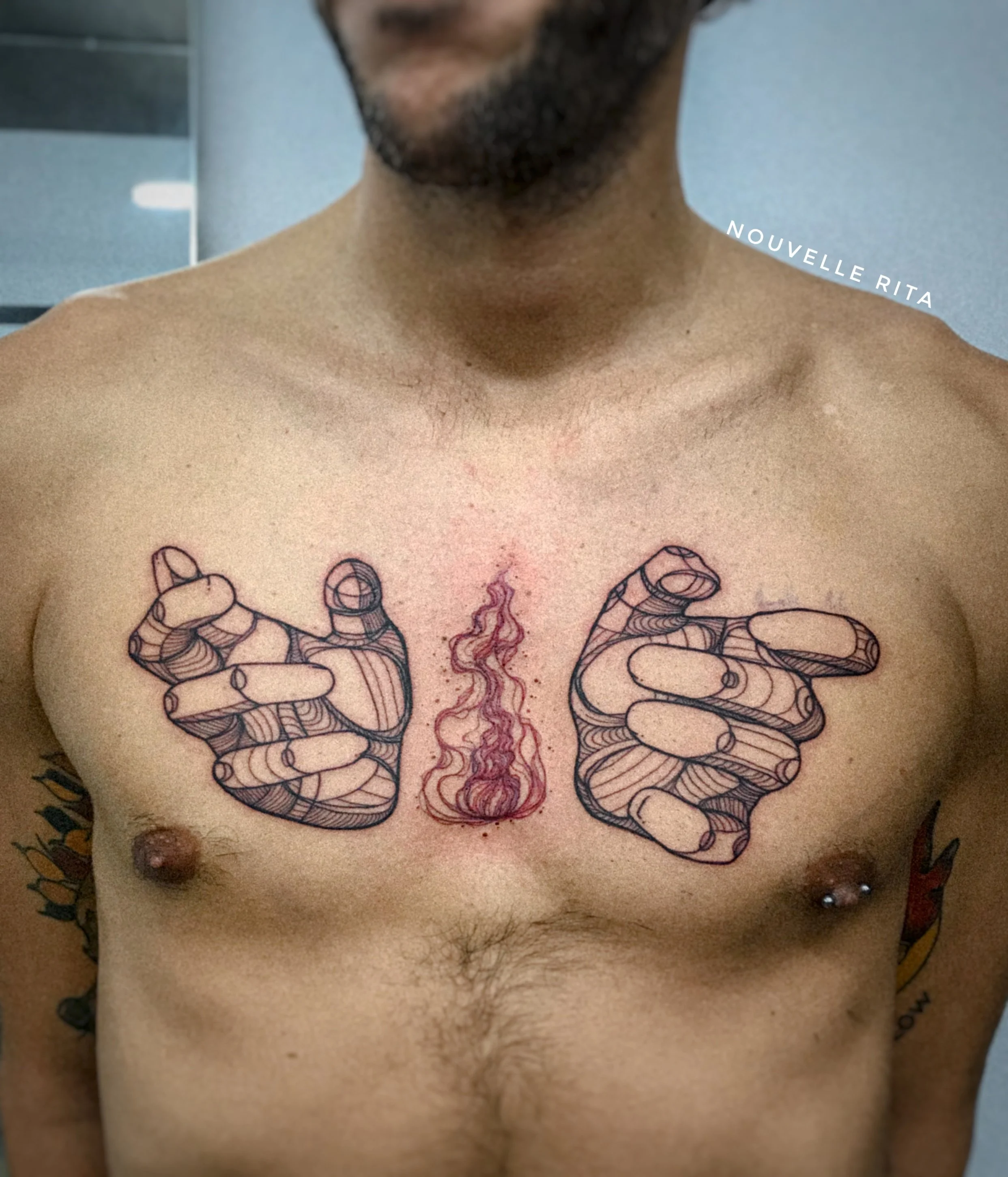 Two hands cup a red flame