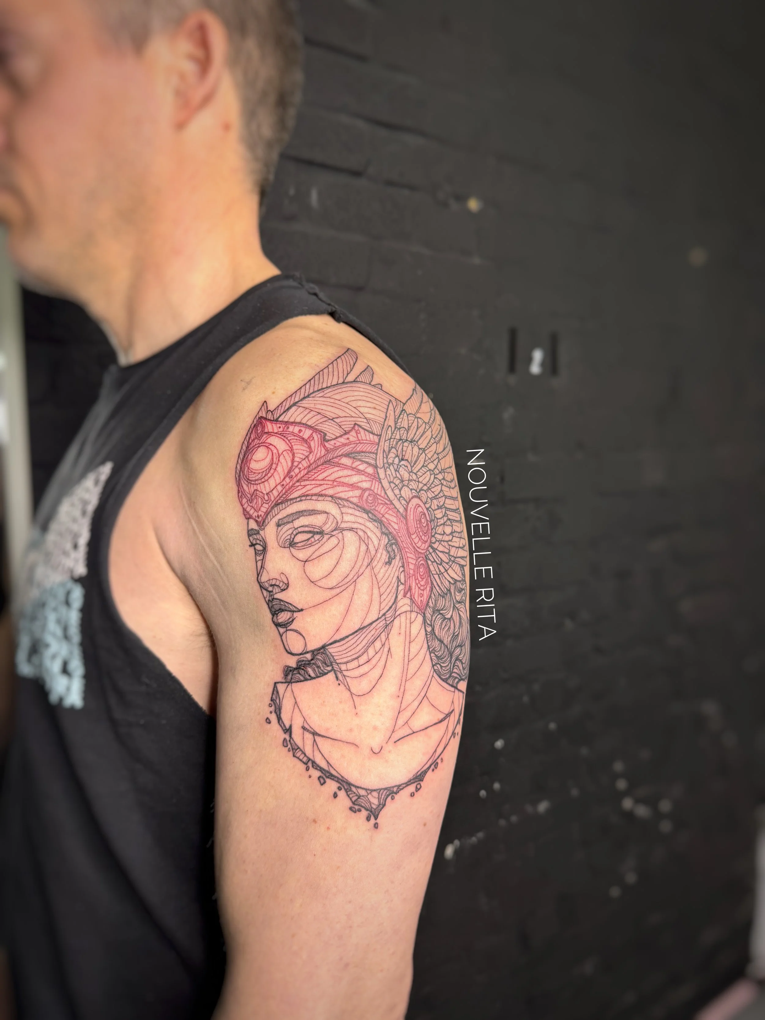 A woman with a red helmet with wings on it