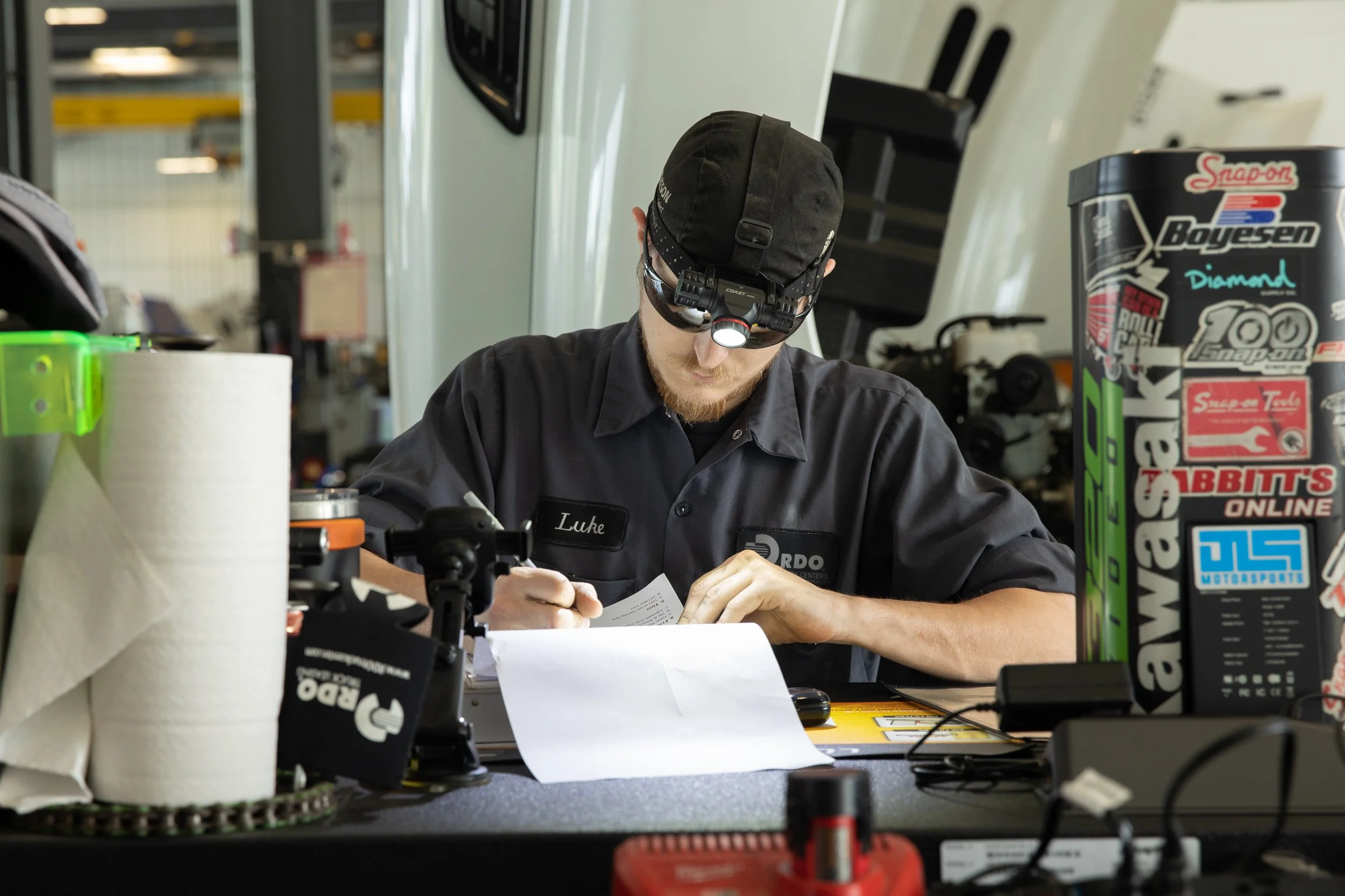 environmental image of industrial work at his station working on paperwork, shot by commercial photographer Corey Rourke
 