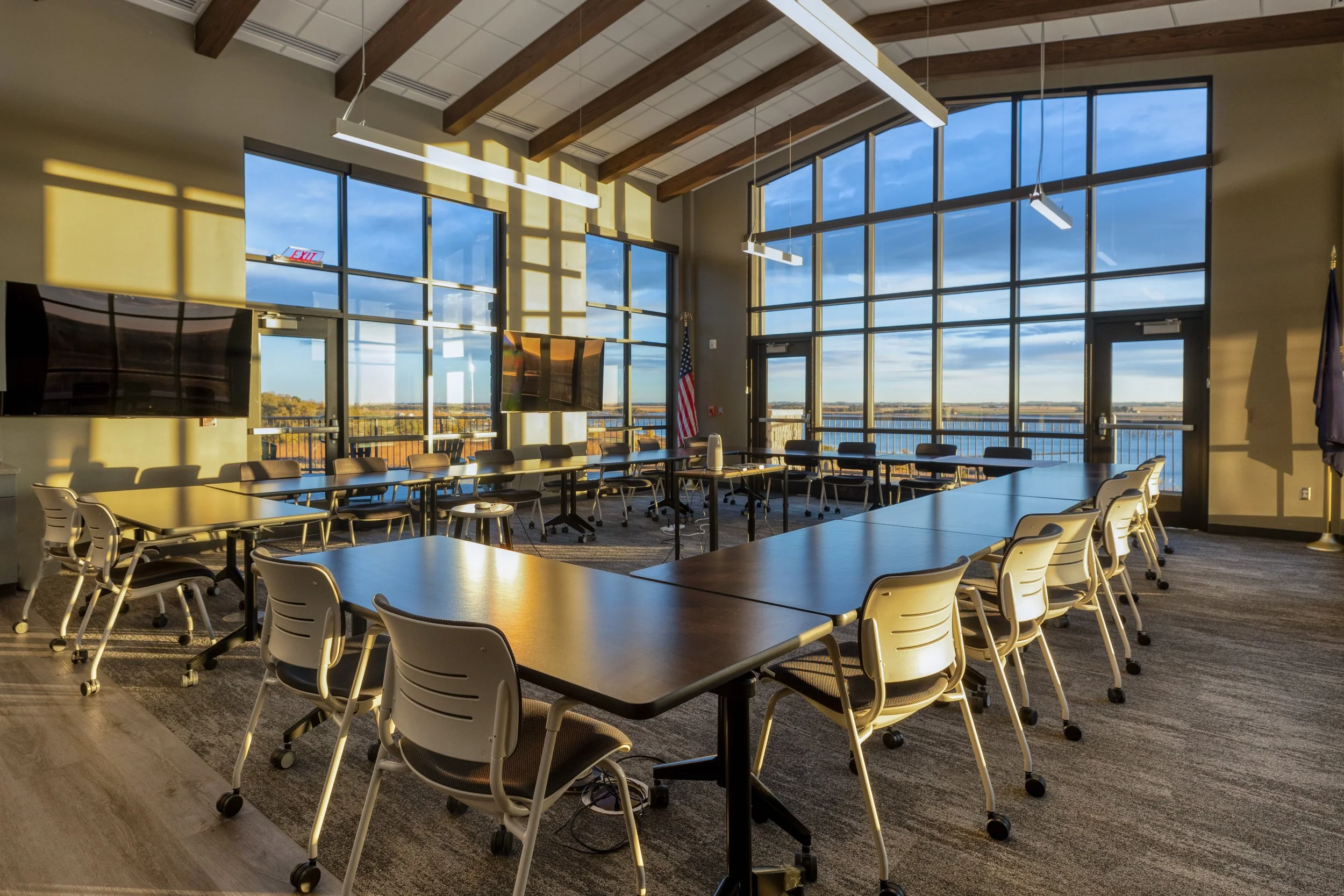 board room with large windows at sunrise