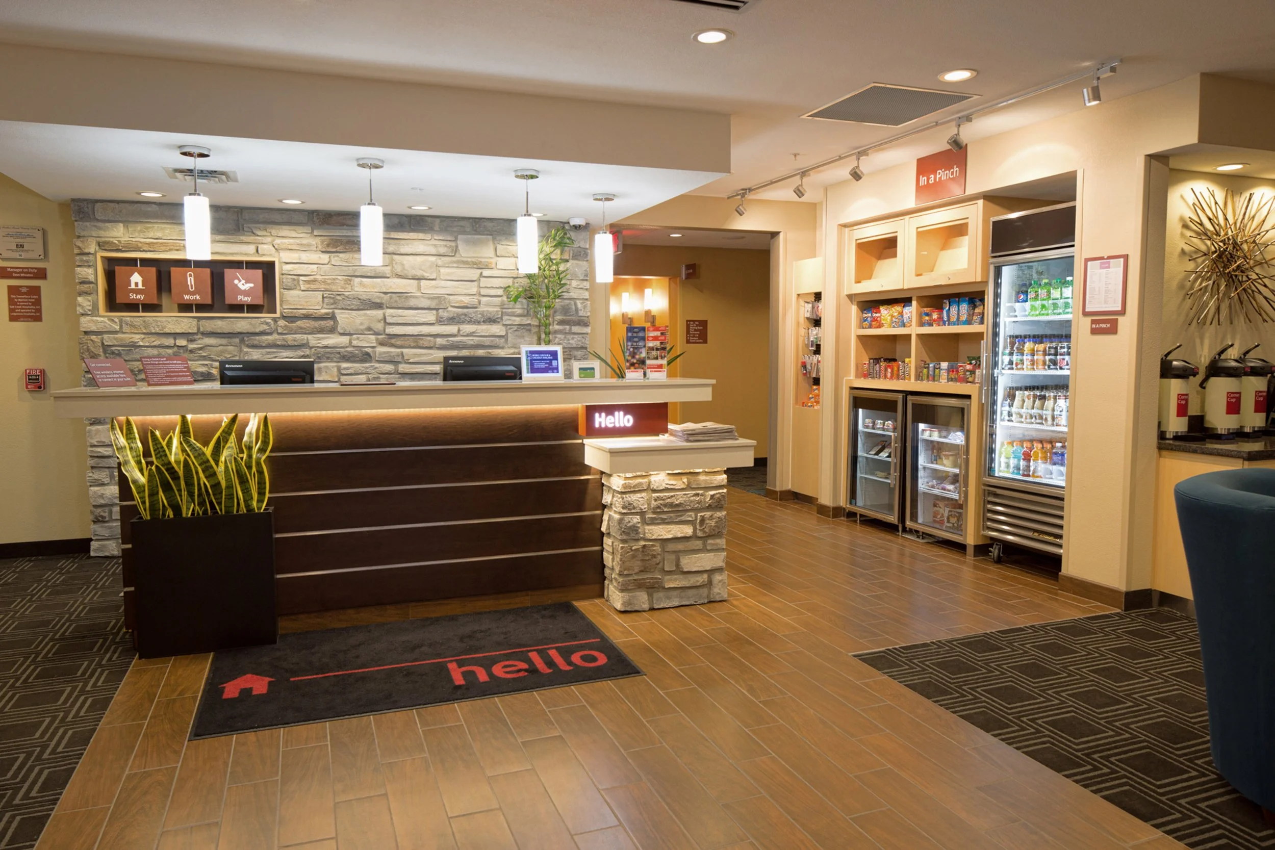 image of front desk of hotel with vending station on the side wall, shot by commercial photographer Corey Rourke

