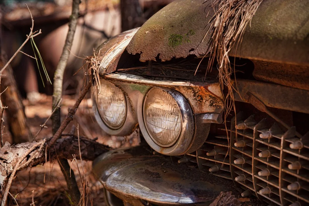 headlights of old abandoned car
