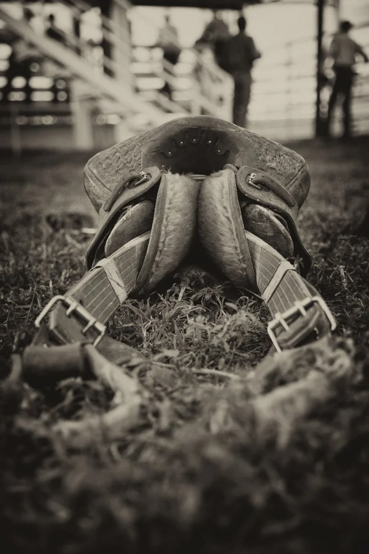 black and white image of saddle on the ground, shot by commercial photographer Corey Rourke

