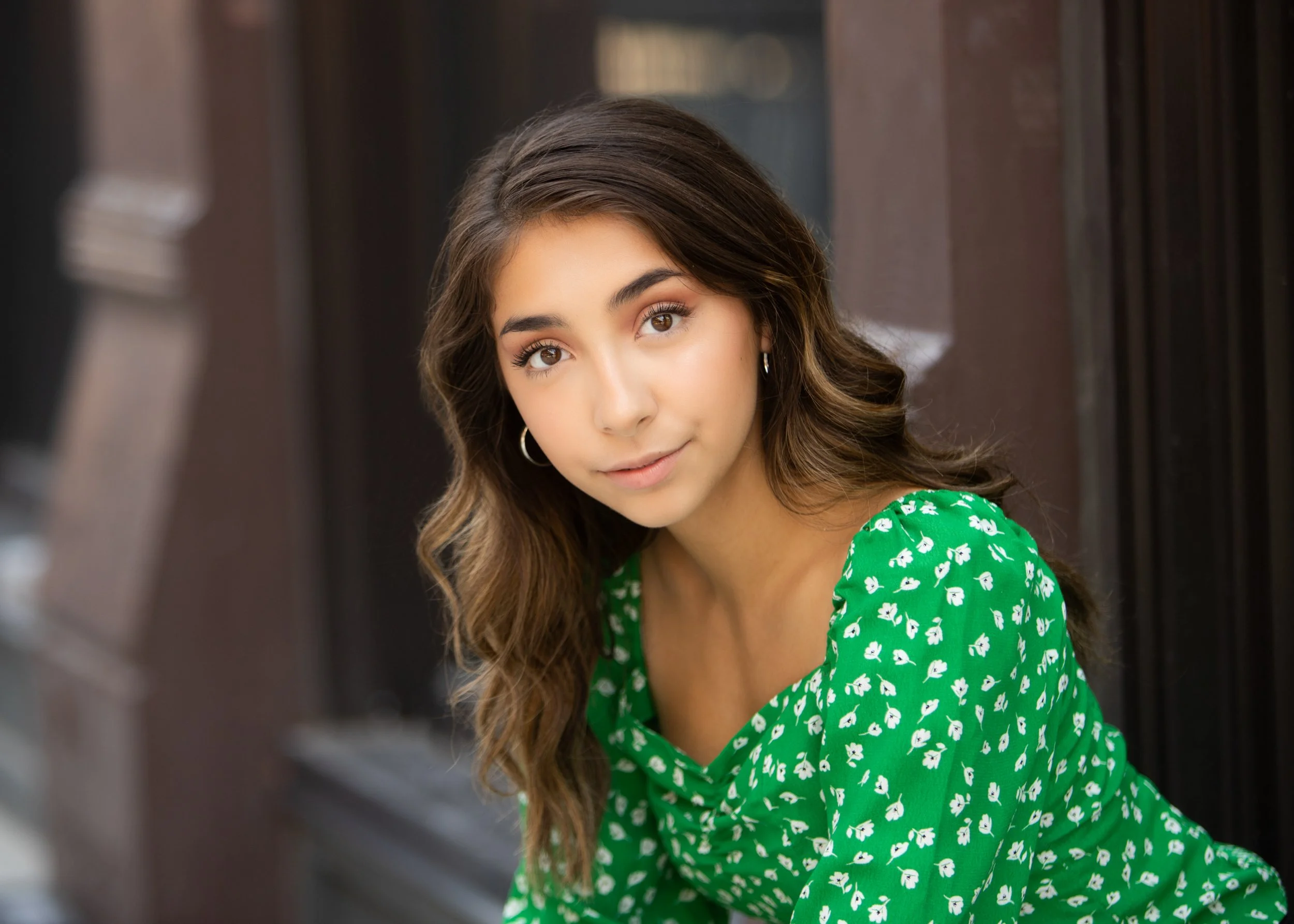 lifestyle portrait of woman in a green dress, shot by commercial photographer Corey Rourke

