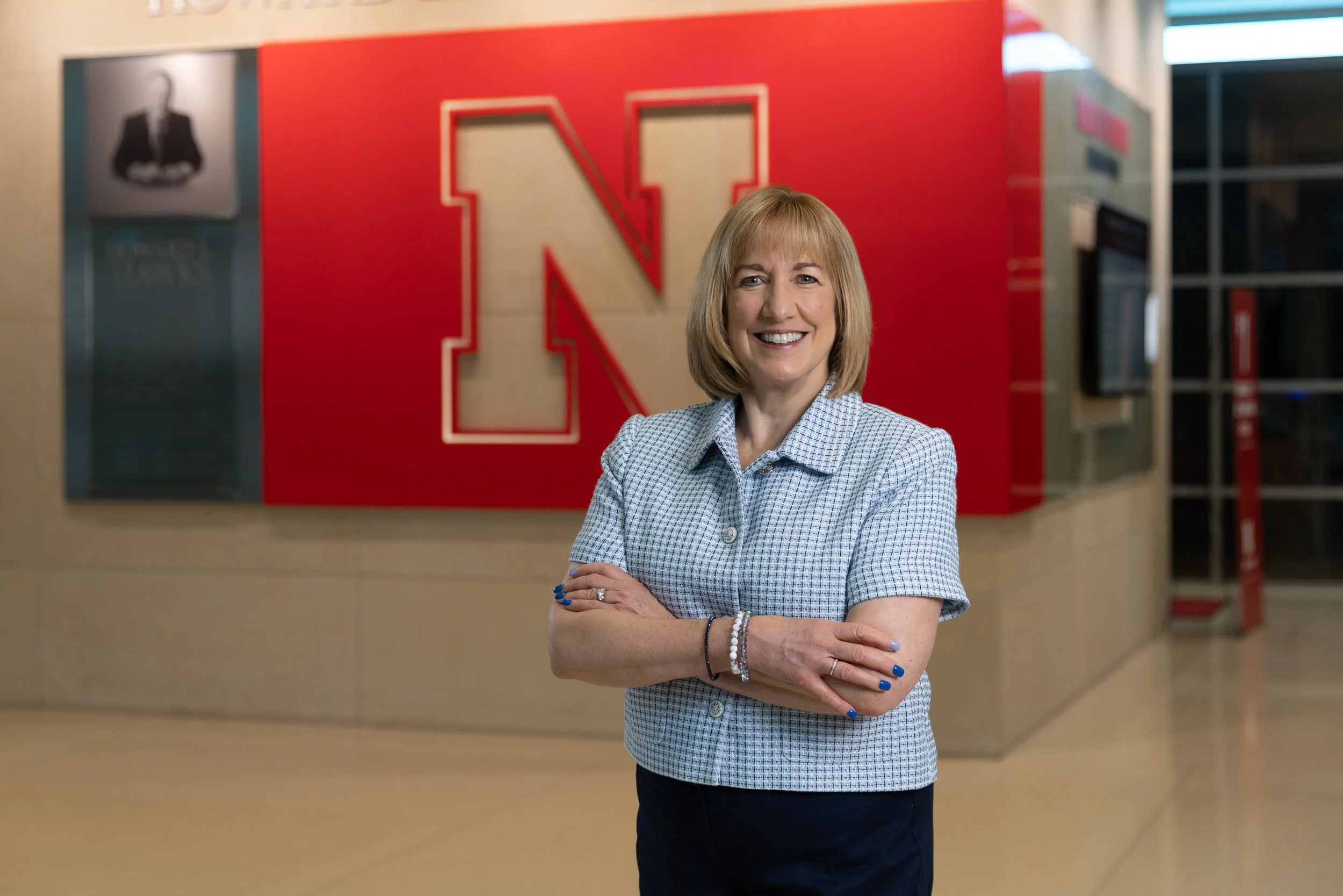 university dean in front of sign