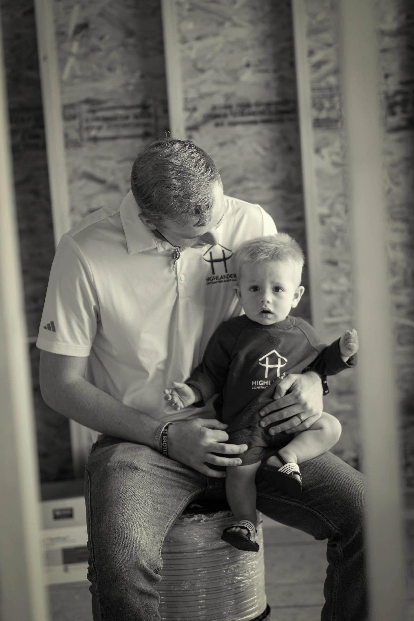 black & white image of construction owner and family