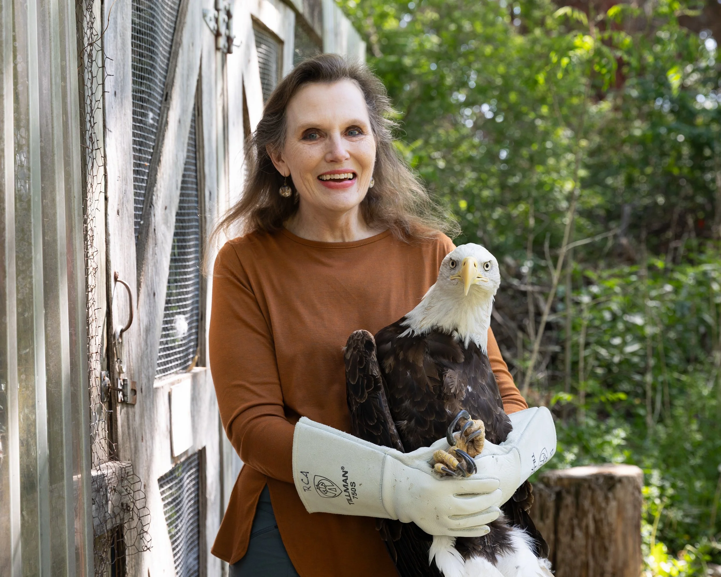 image of woman holding a rescue raven

