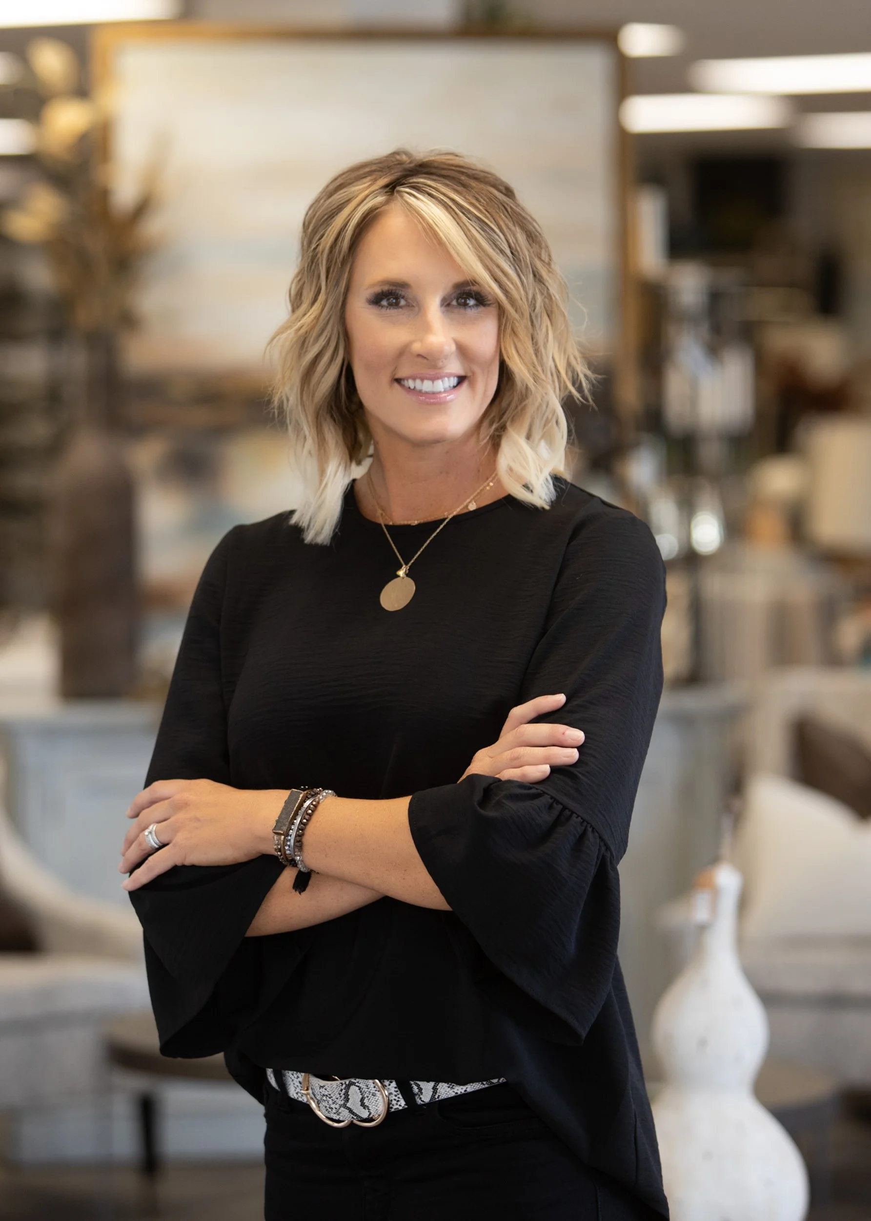 lifestyle portrait of woman crossing her arms inside a interior decor office, shot by commercial photographer Corey Rourke

