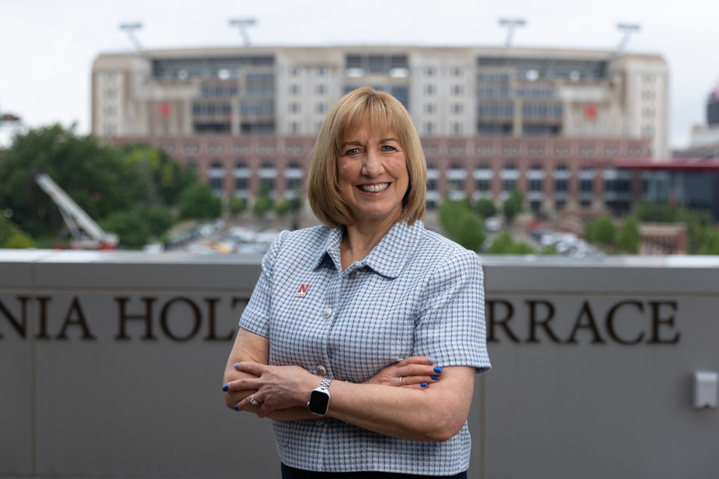 university dean with stadium in background