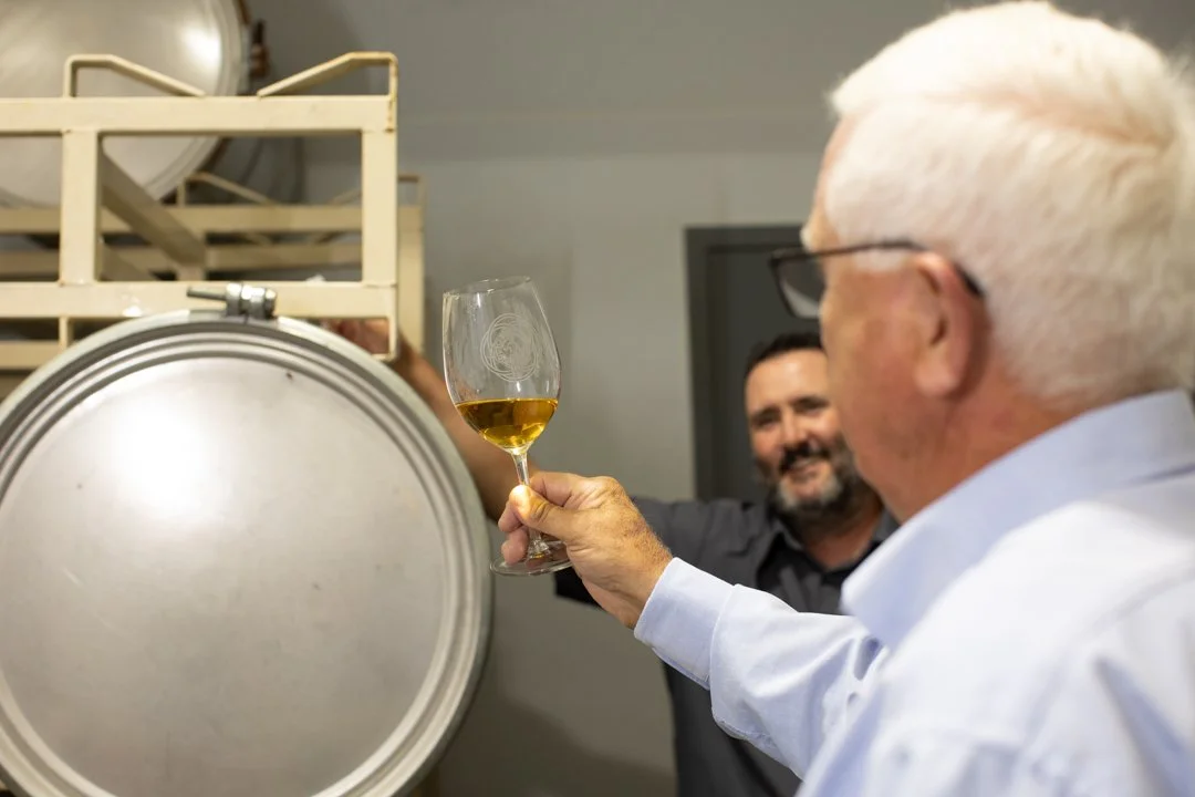 Vintner check color of wine, shot by commercial photographer Corey Rourke

