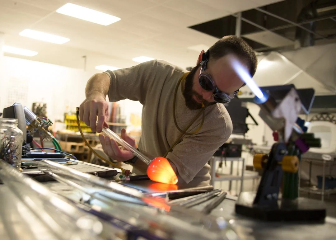 glass blower shaping glass rod, shot by commercial photographer Corey Rourke

