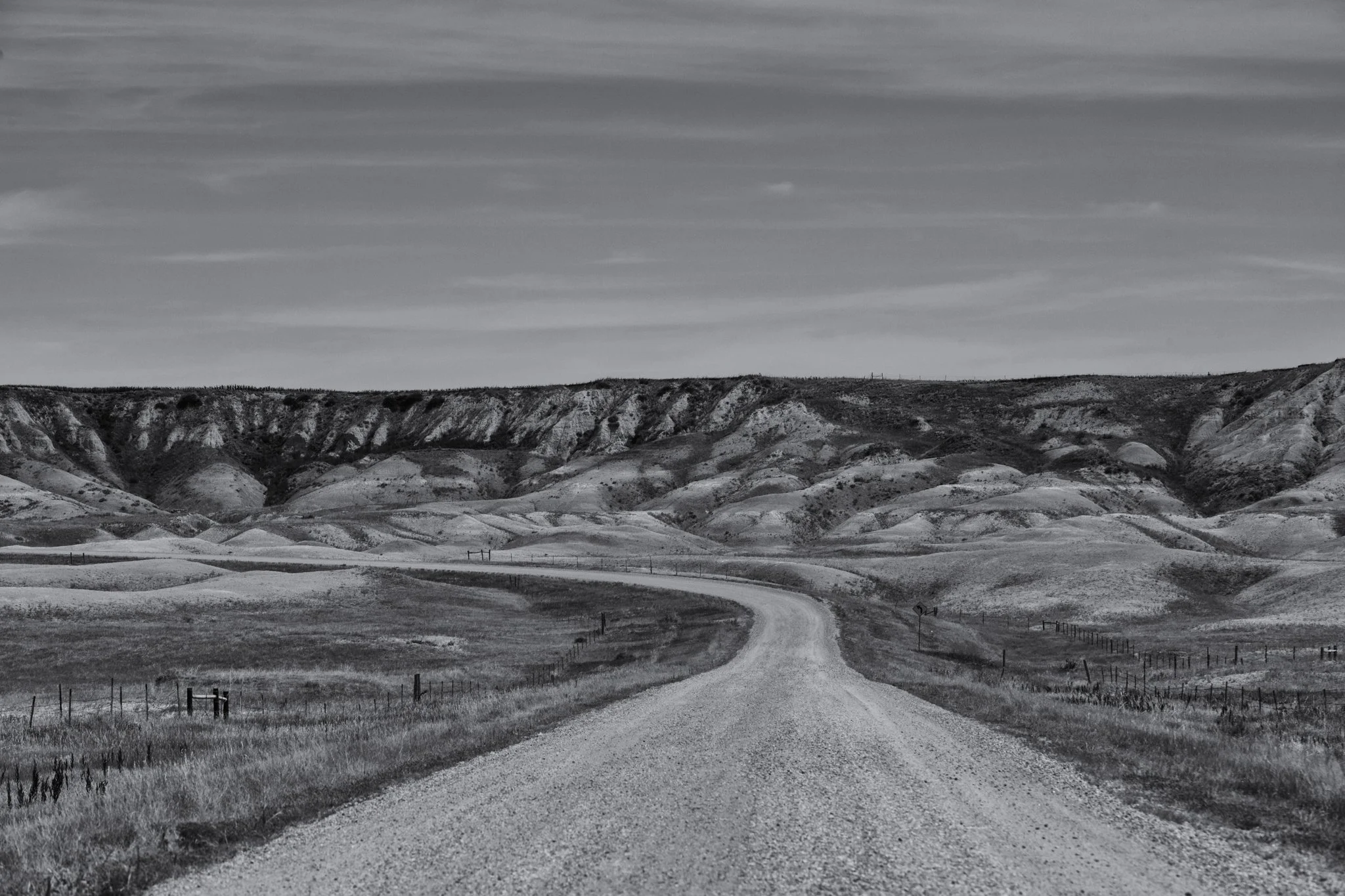 black and white image of a road winding into the mountains in South Dakota
