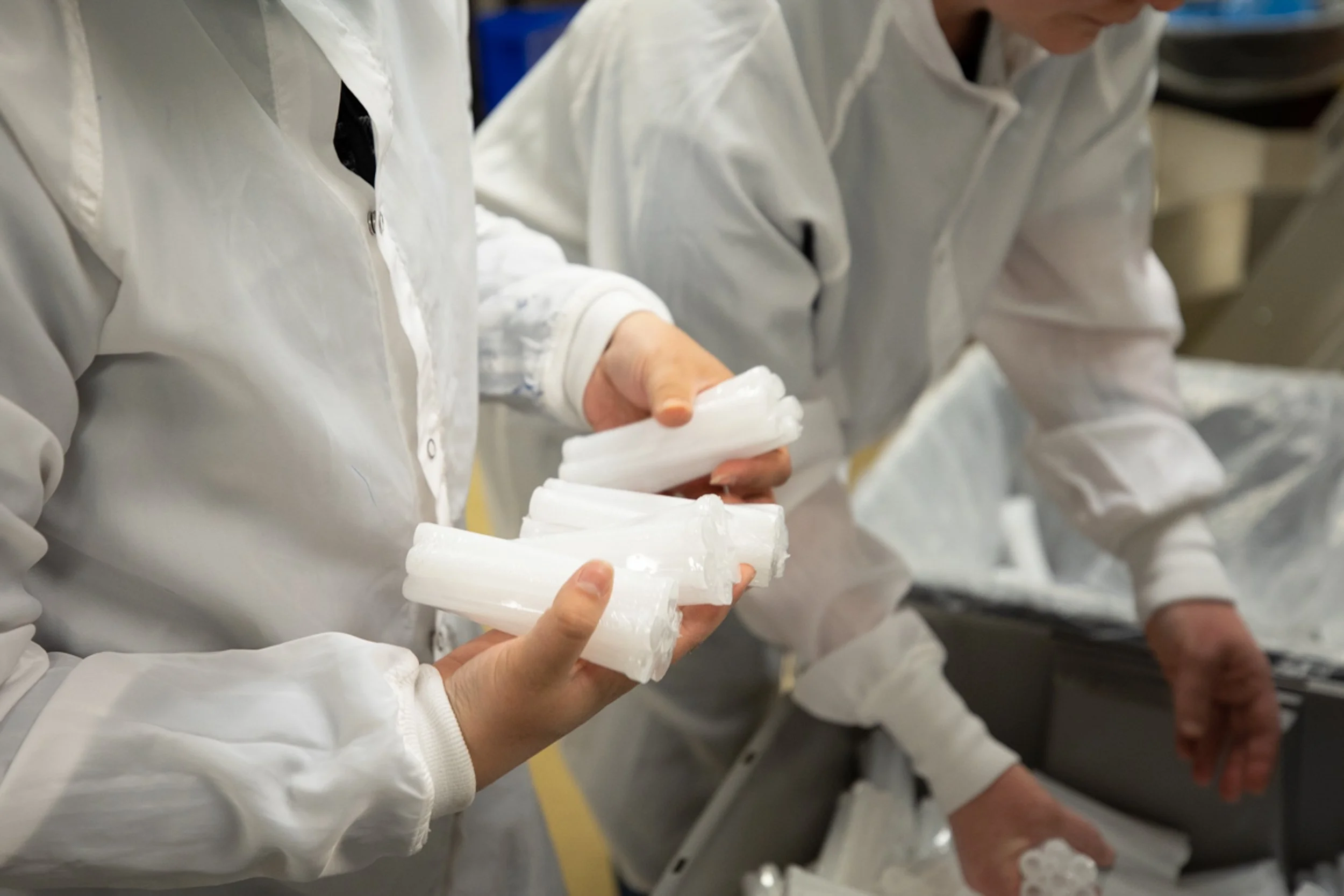 close up image of manufactures sorting plastic bottles, shot by commercial photographer Corey Rourke
