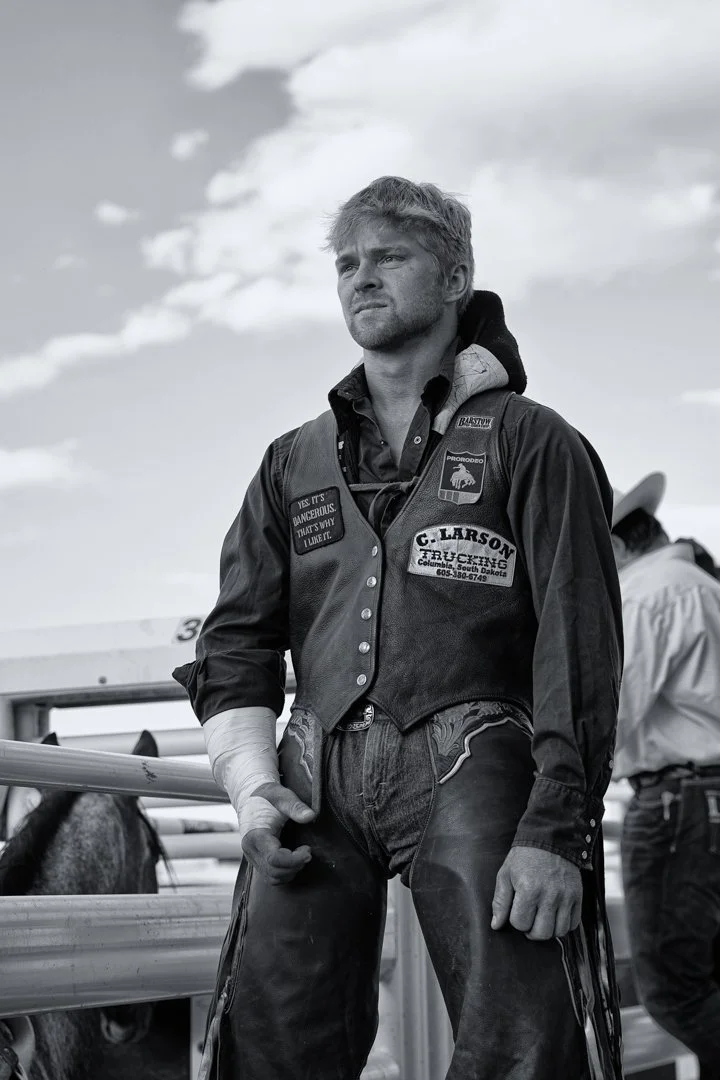 black and white portrait of Bull rider with broken arm, shot by commercial photographer Corey Rourke

