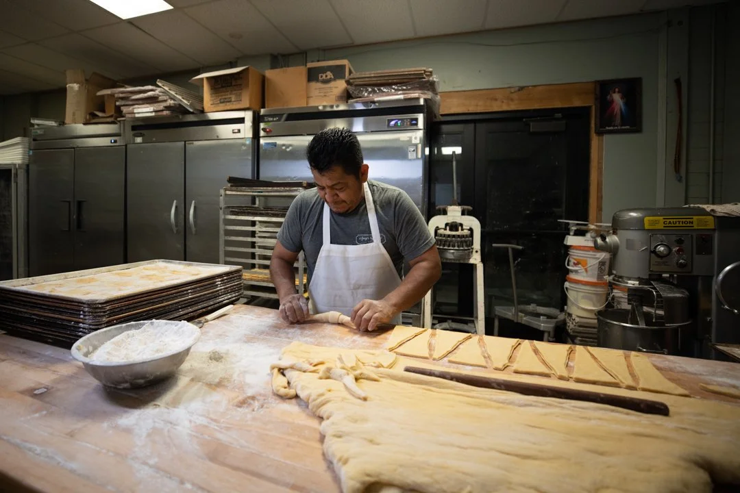 baker rolling crosiants, shot by commercial photographer Corey Rourke

