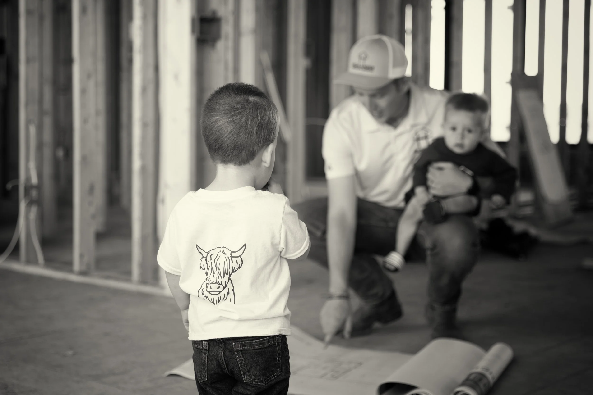 black & white image of construction owner and family